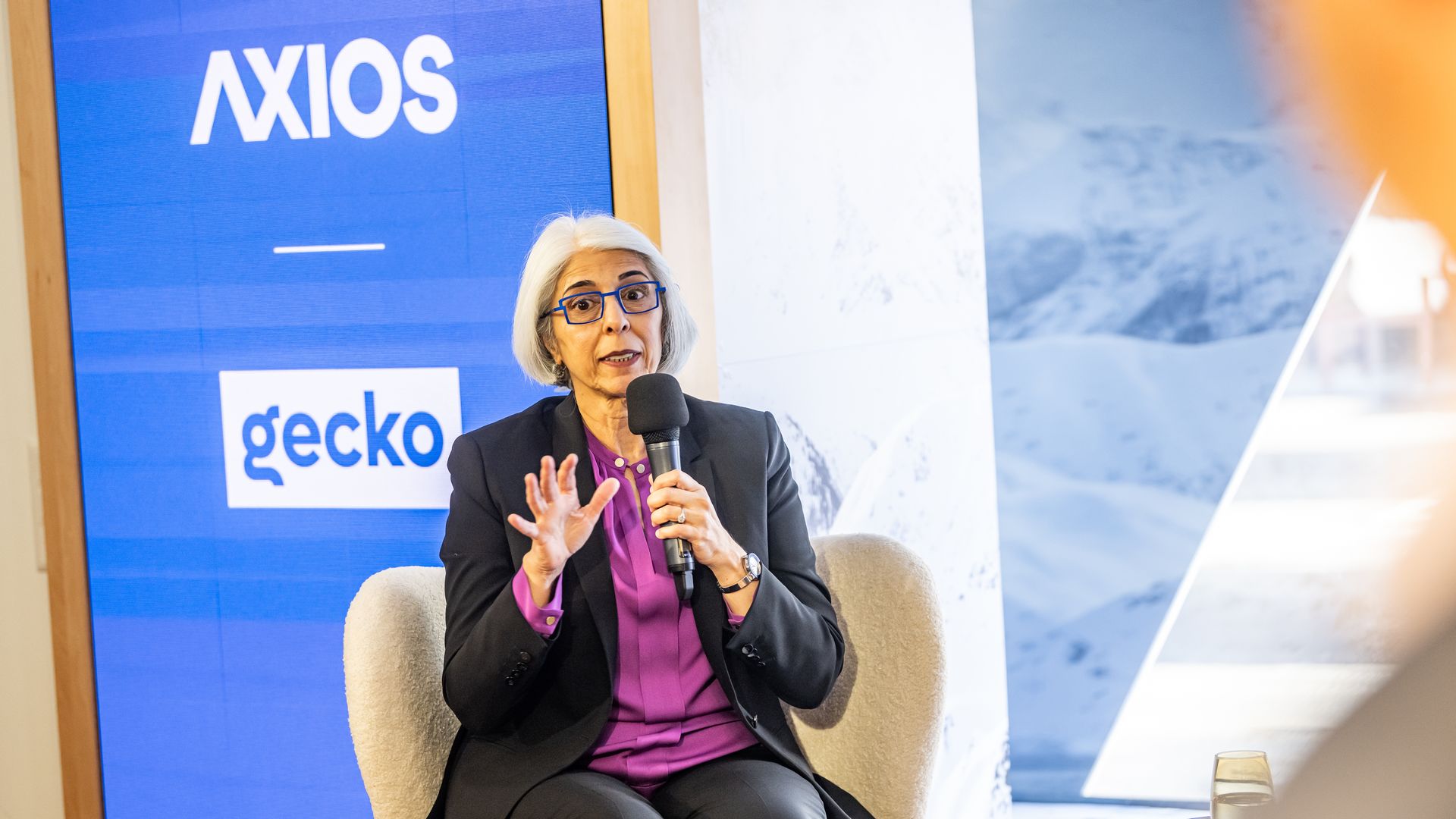 White House OSTP’s Arati Prabhakar sitting and speaking on the Axios stage. 
