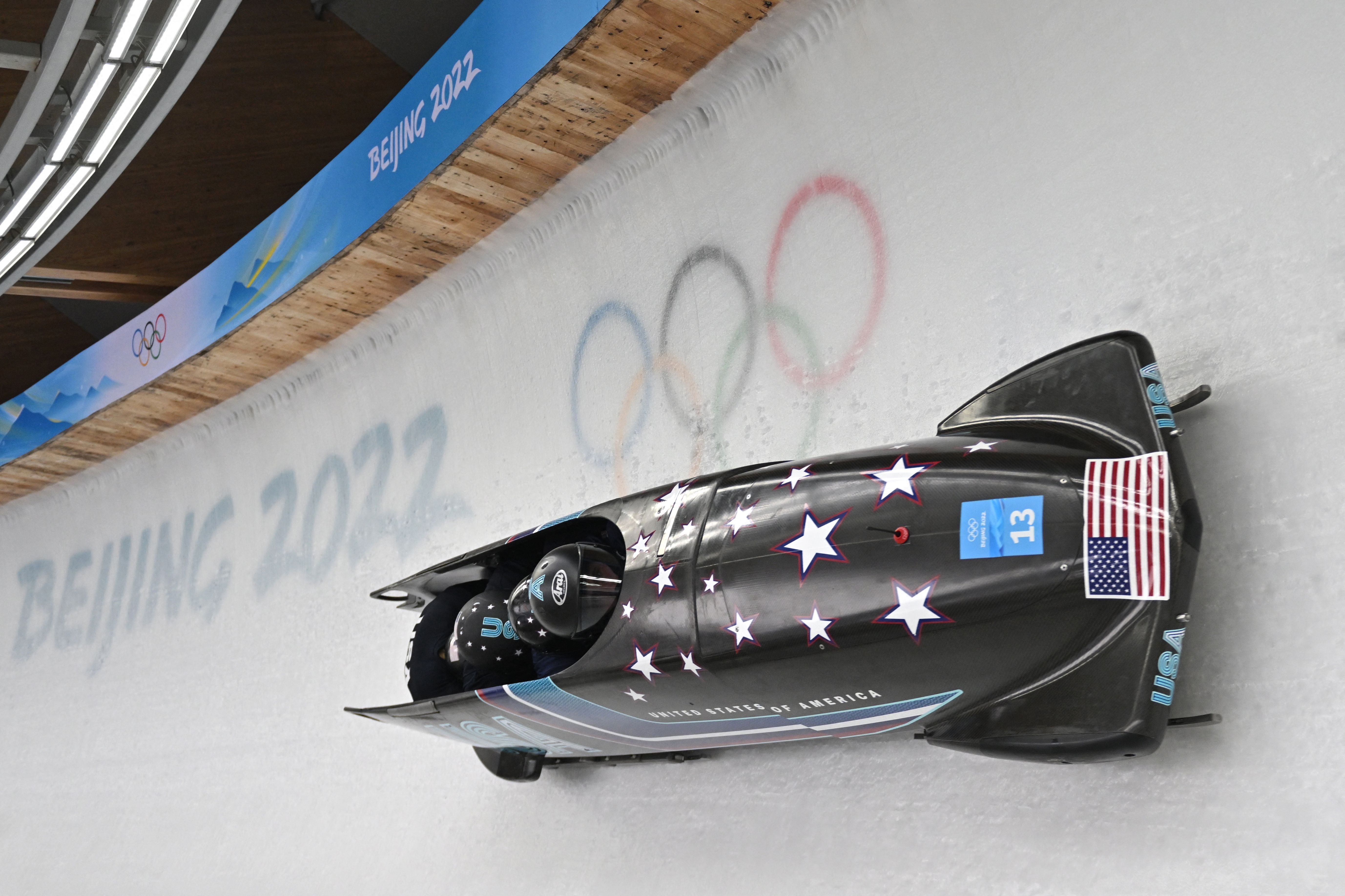 American Frank Delduca and his team take part in the 4-man bobsleigh training at the Yanqing National Sliding Centre during the Beijing 2022 Winter Olympics Feb. 18.