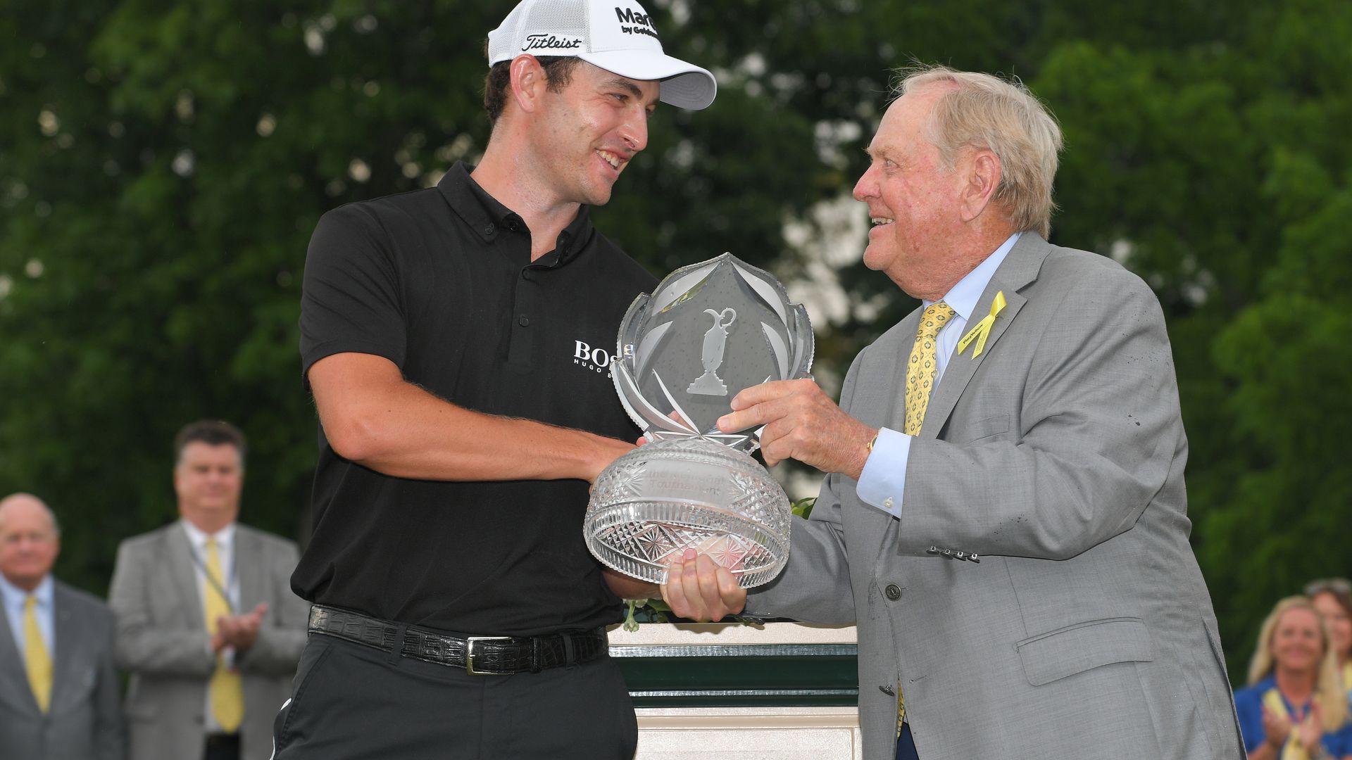 Jack Nicklaus handing a Memorial Tournament trophy to 2021 winner Patrick Cantlay.