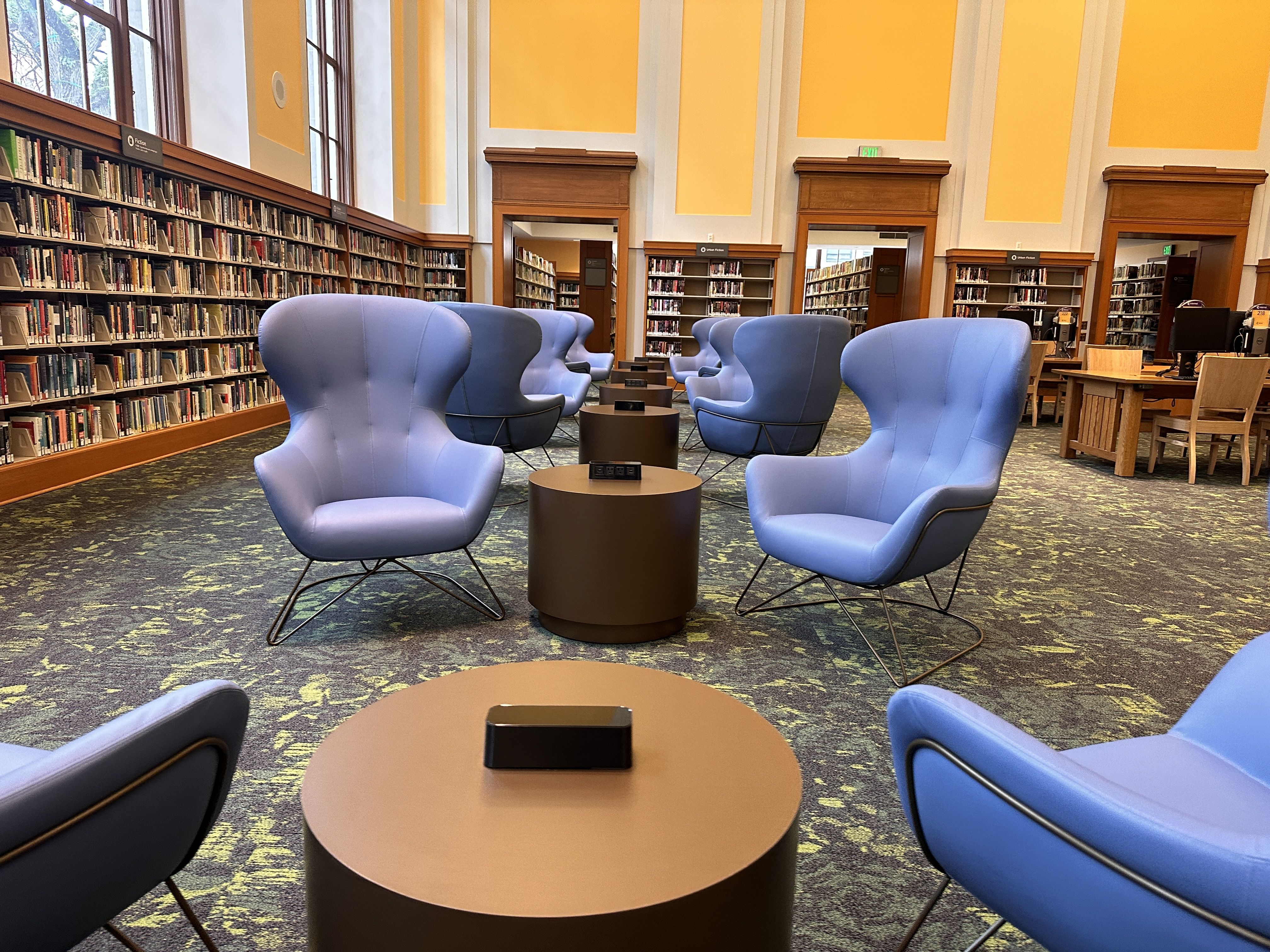 Blue cozy chairs in a library.