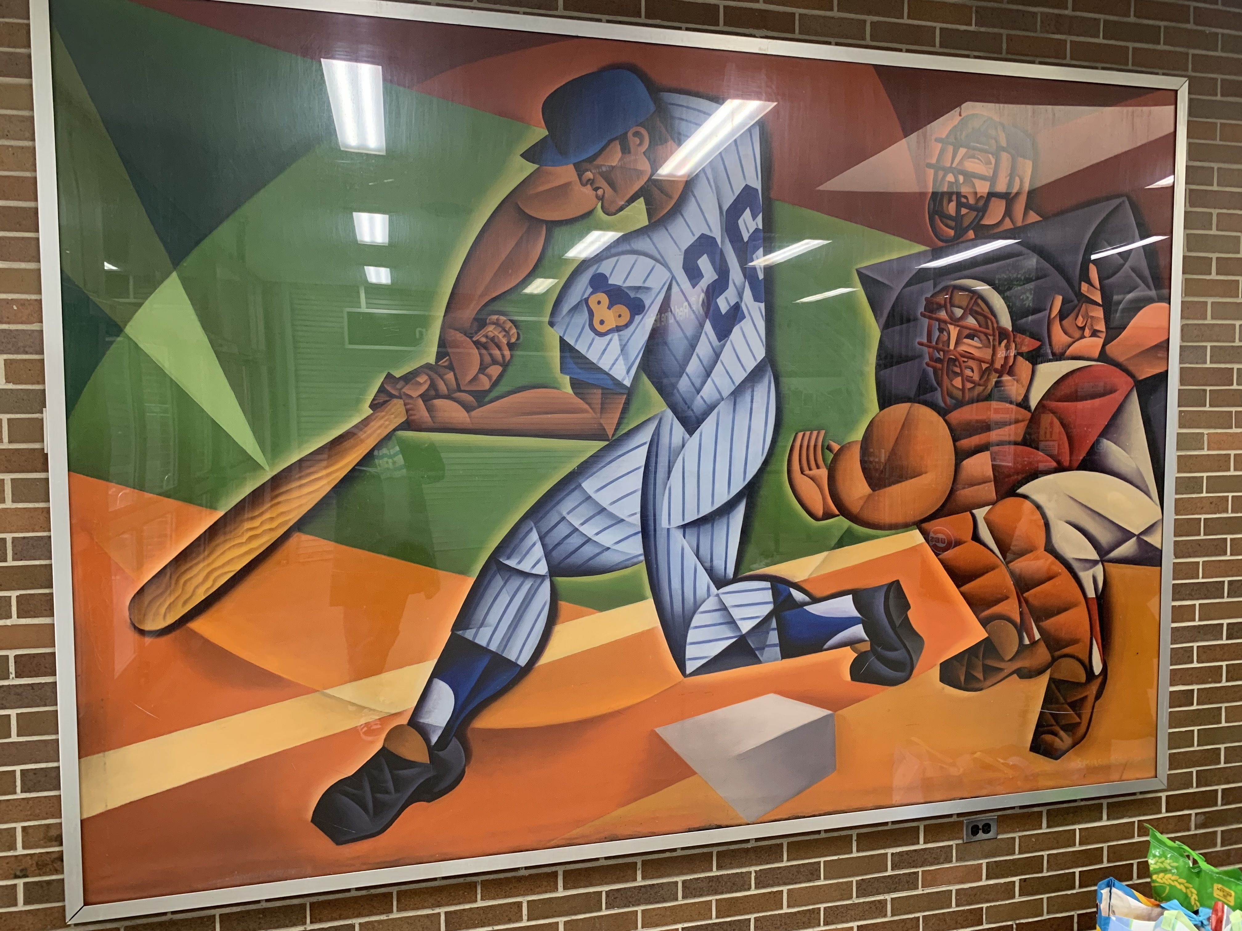 Colorful cubist painting of a baseball player in pinstripes swinging a bat toward home plate, with catcher and umpire behind him in red and black gear.