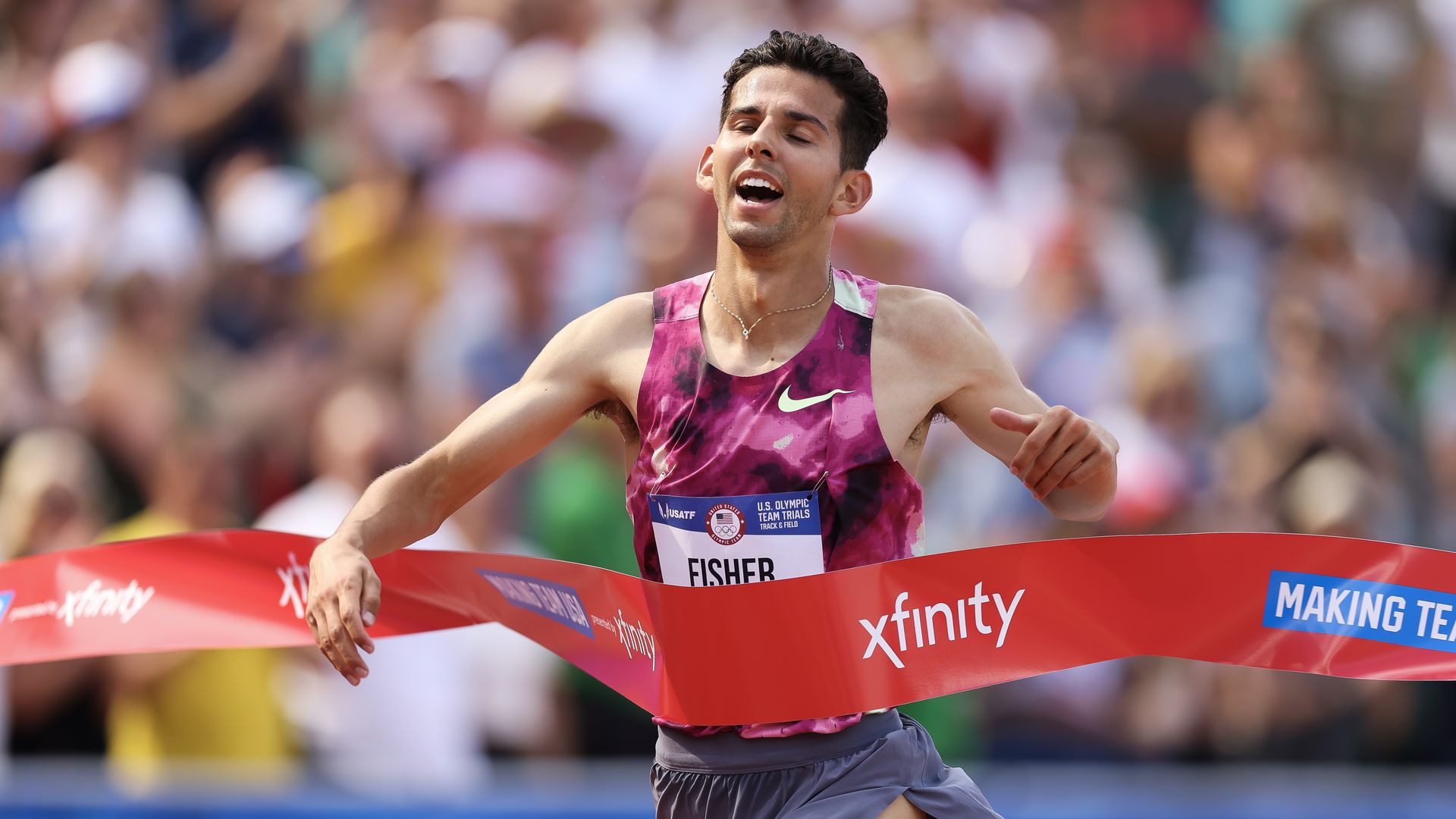 Grant Fisher crosses the finish line to win the men's 5,000 meter final at the 2024 U.S. Olympic Team Track & Field Trials in Oregon. 