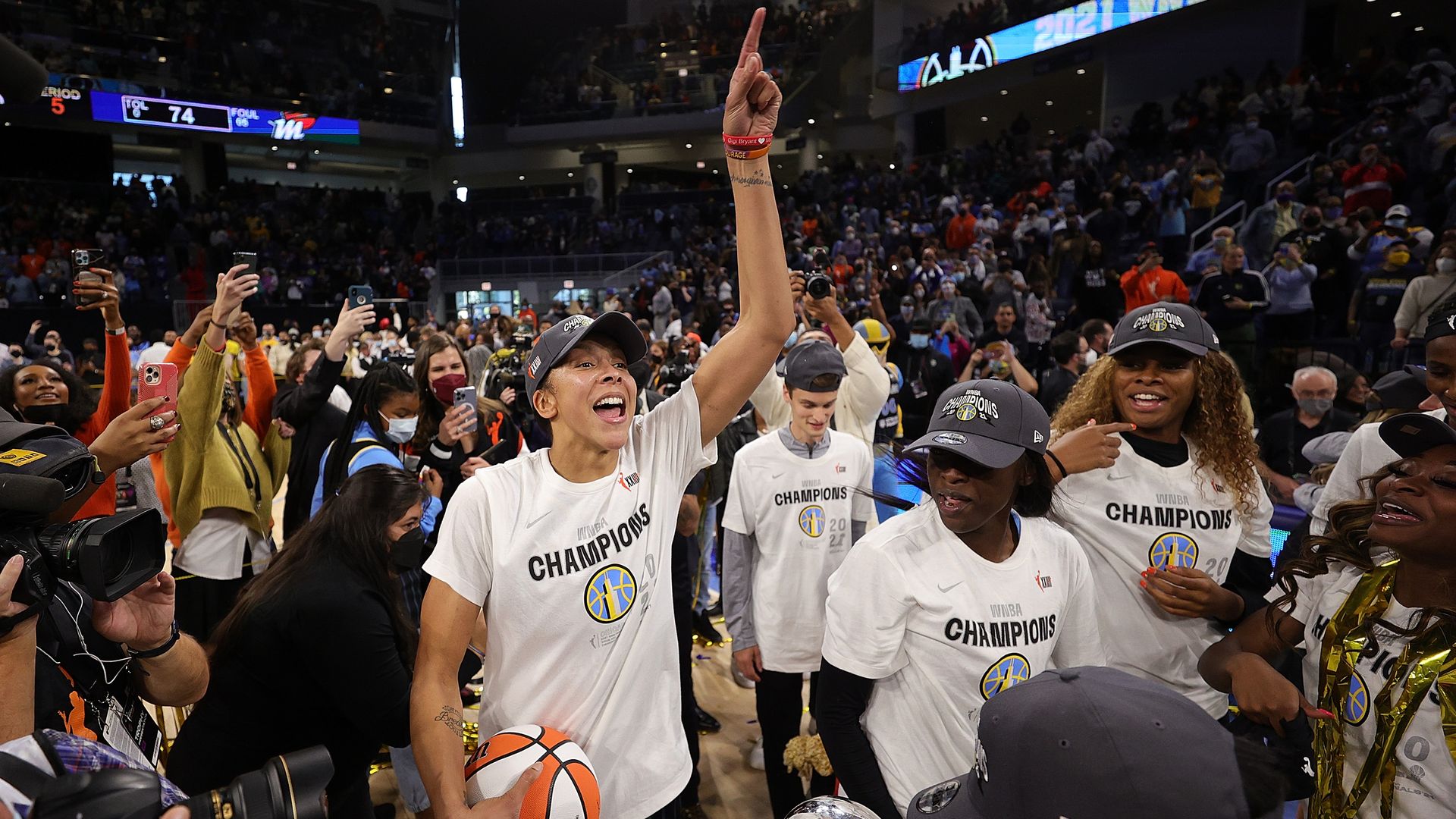 Chicago Sky teammates celebrate on the court. 