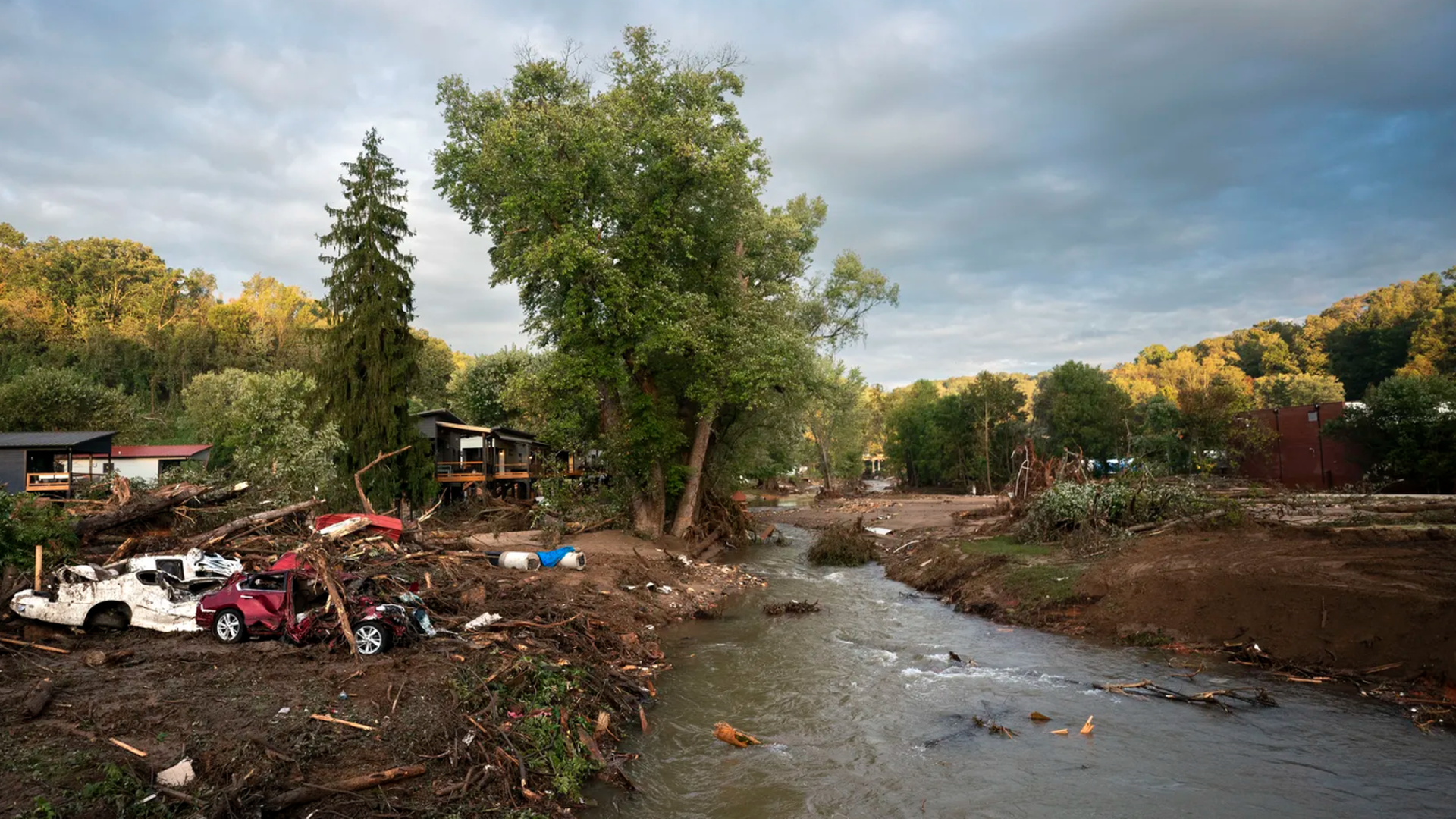 Storm damaged cars sit along Mill Creek in the aftermath of Hurricane Helene on Sept. 30 in Old Fort, North Carolina.