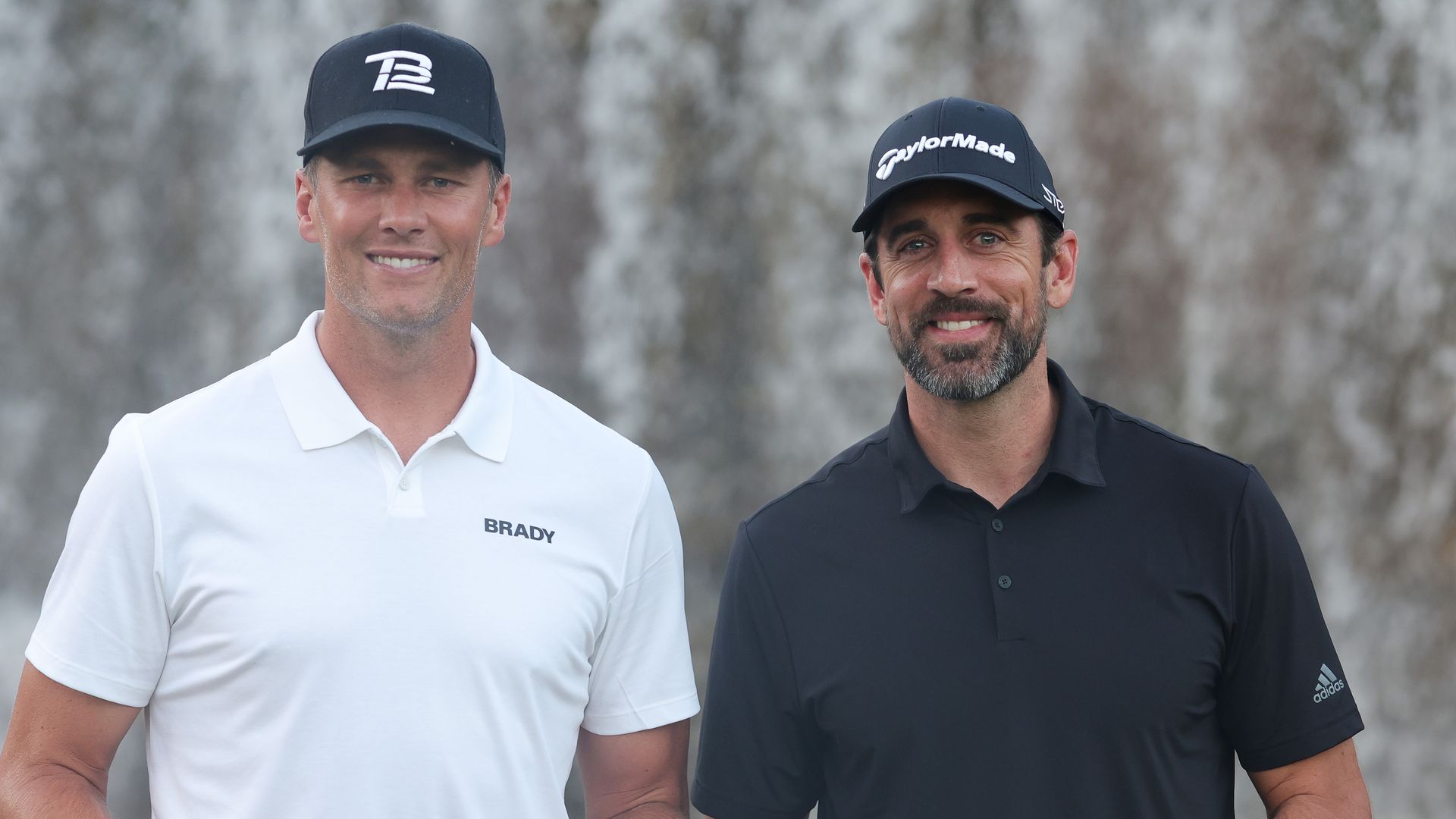 Tom Brady and Aaron Rogers stand next to each other.