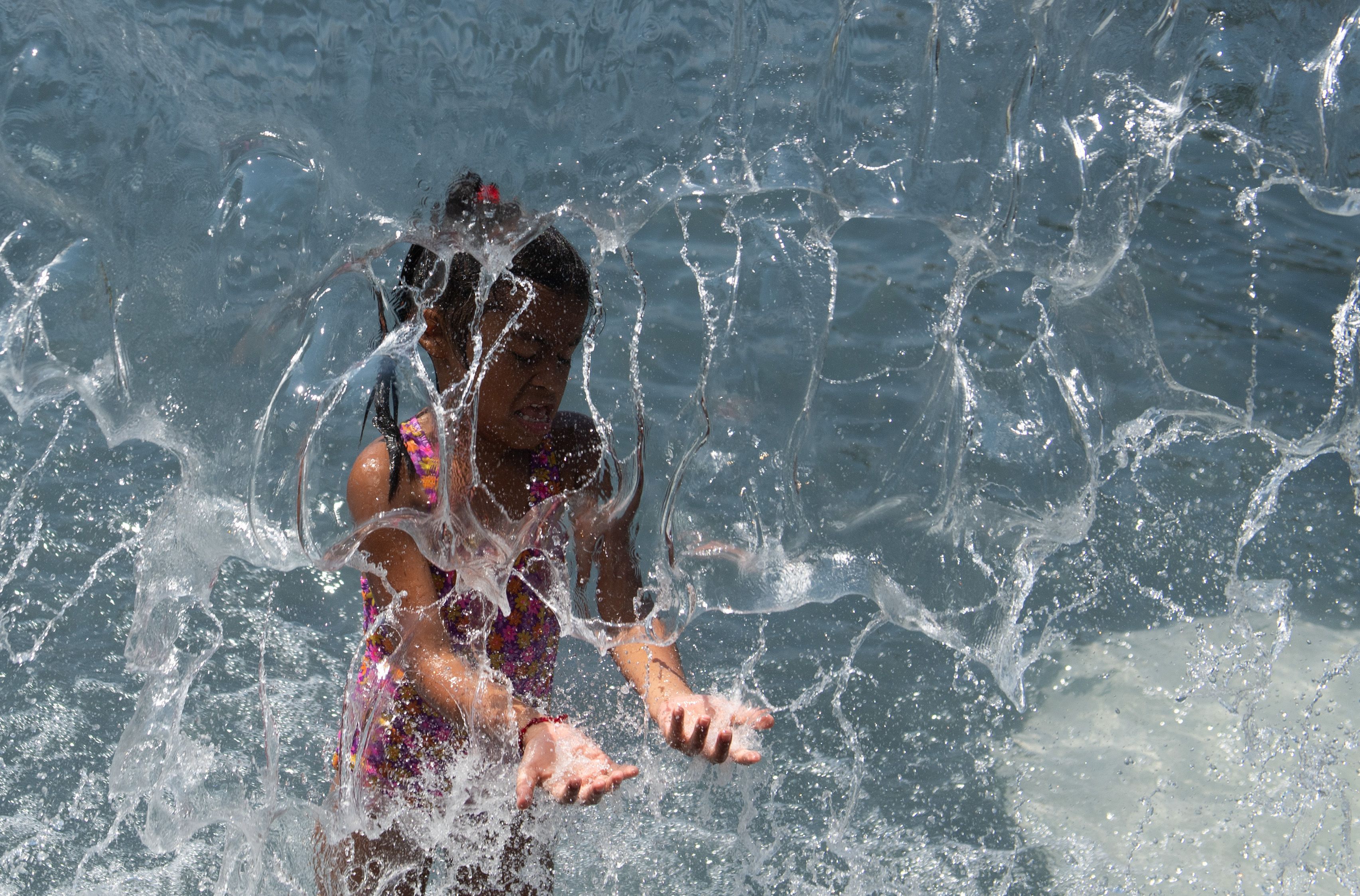  A child plays in a waterfall at Yards Park in Washington, D.C. 
