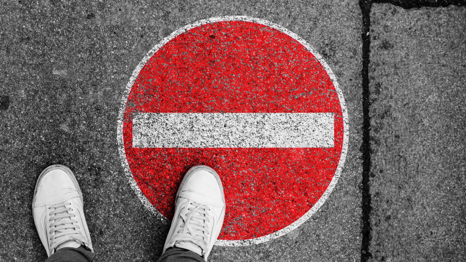 Illustration of a no entry sign on a cement sidewalk.
