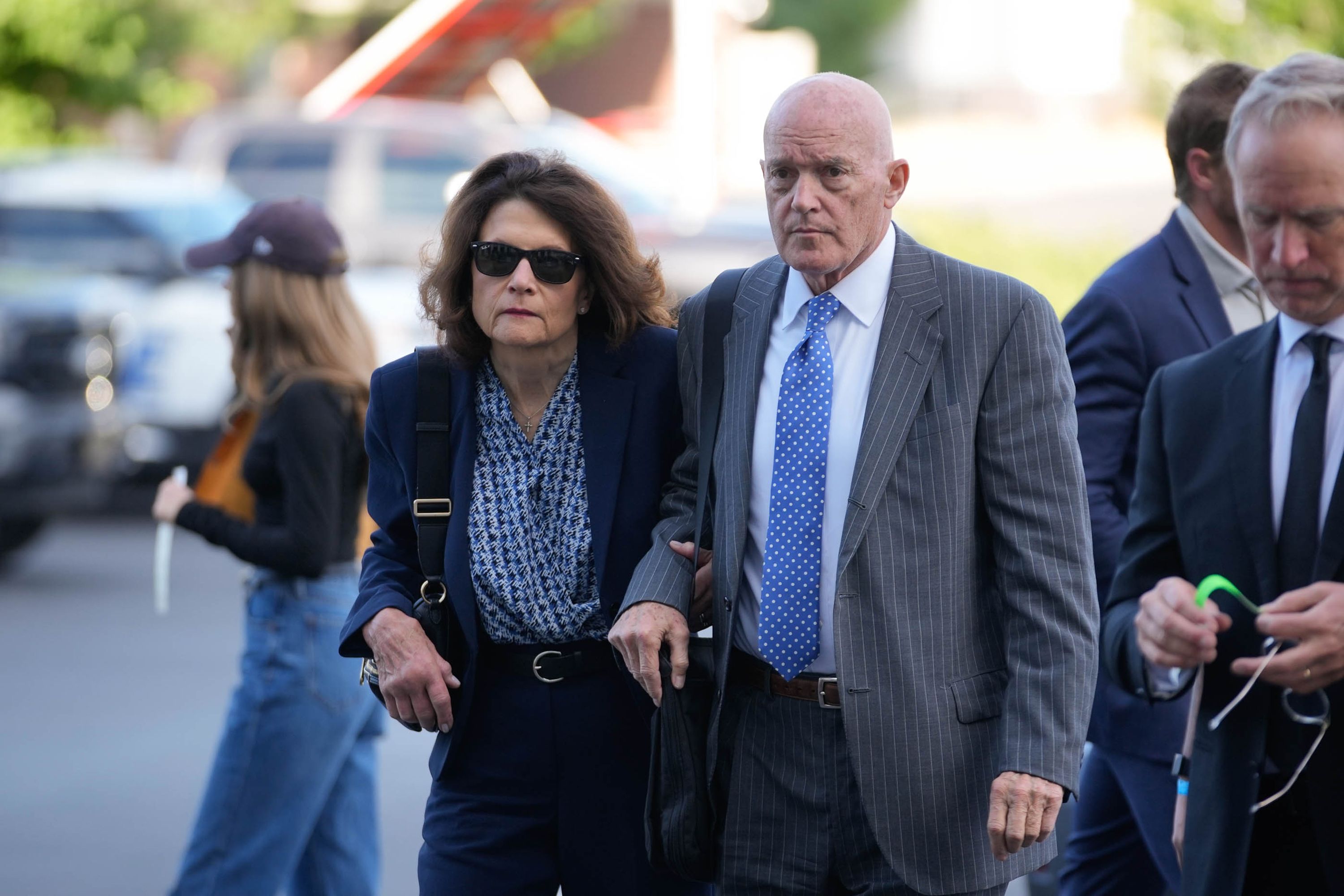 The Kirks walk to a courthouse