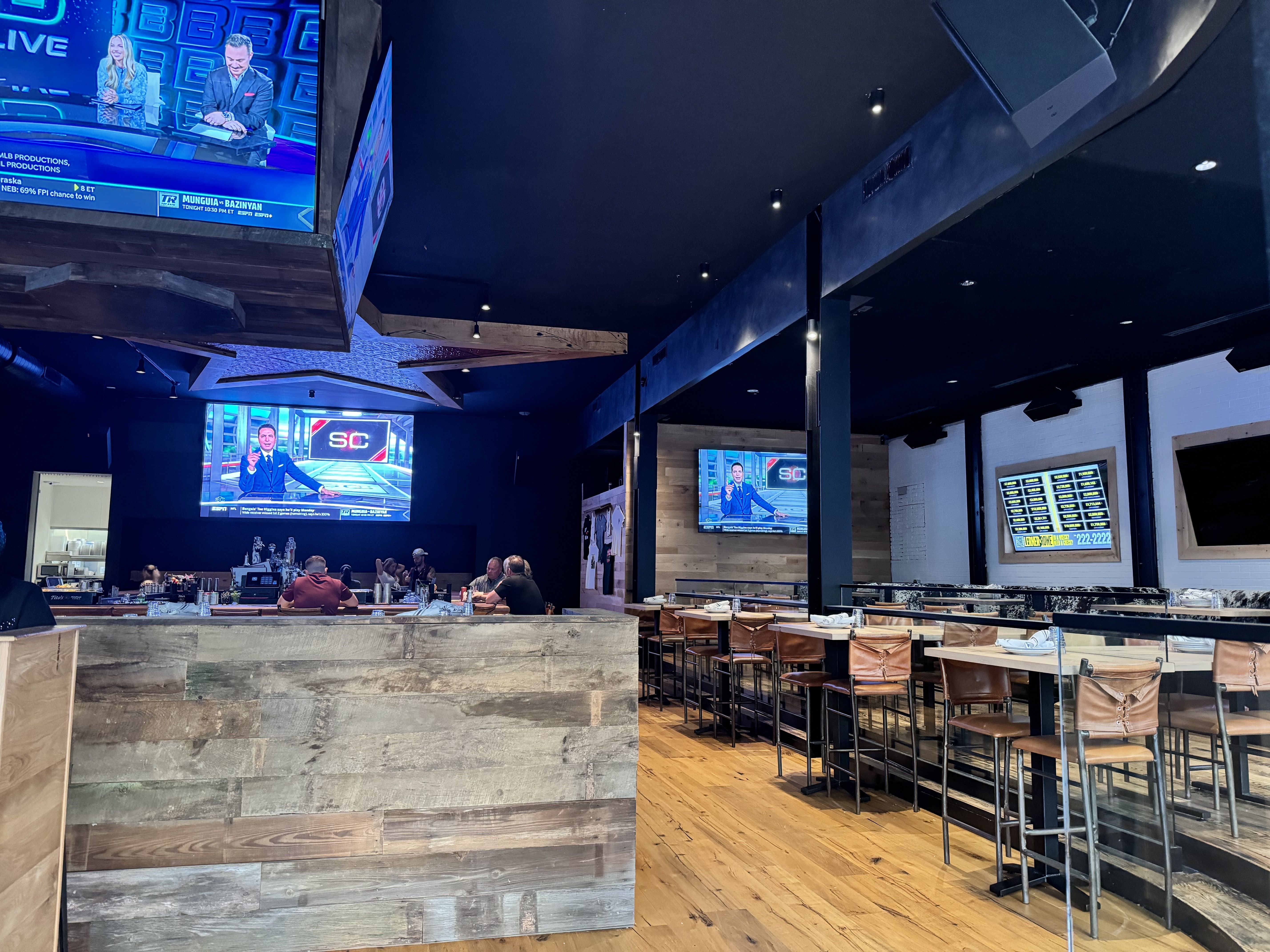 Photo of a sports bar with televisions showing sports.