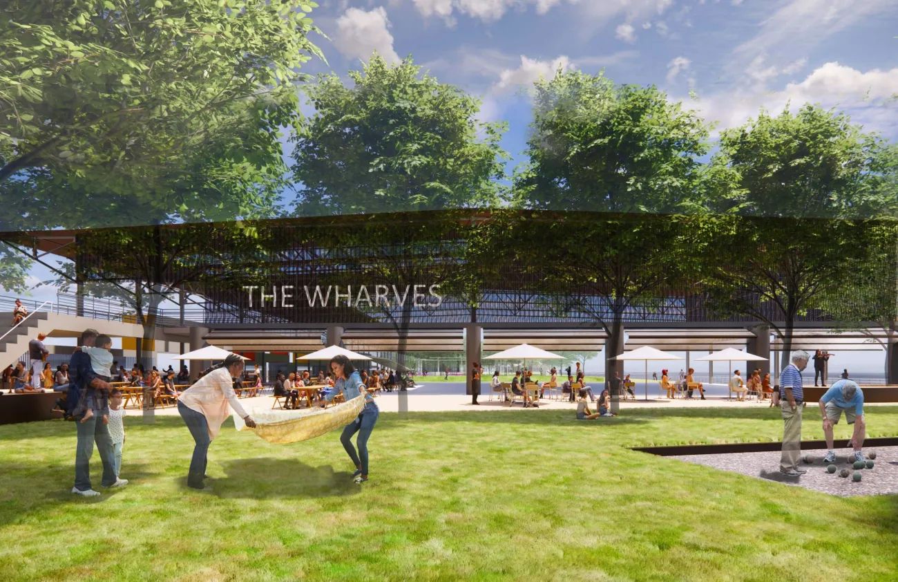 Rendering shows an open-facility called "The Wharves" on the Mississippi River in New Orleans