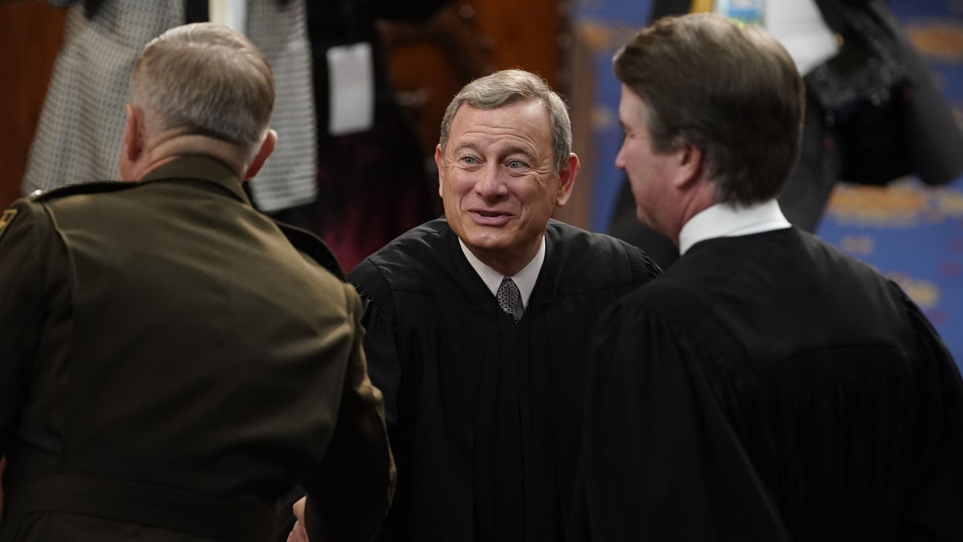 John Roberts, chief justice of the U.S. Supreme Court, center, attends the State of the Union.