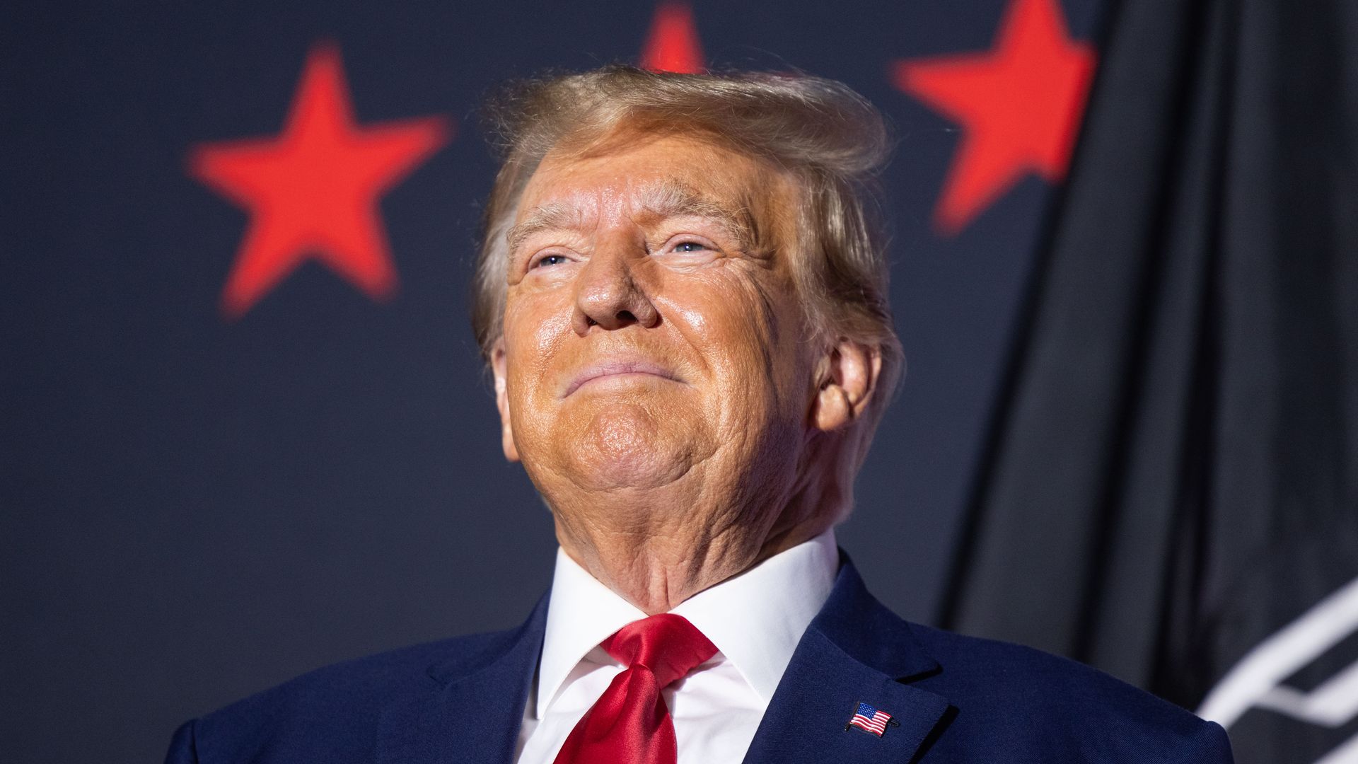 Former U.S. President Donald Trump on stage before delivering remarks at Windham High School on August 8, 2023 in Windham, New Hampshire. 