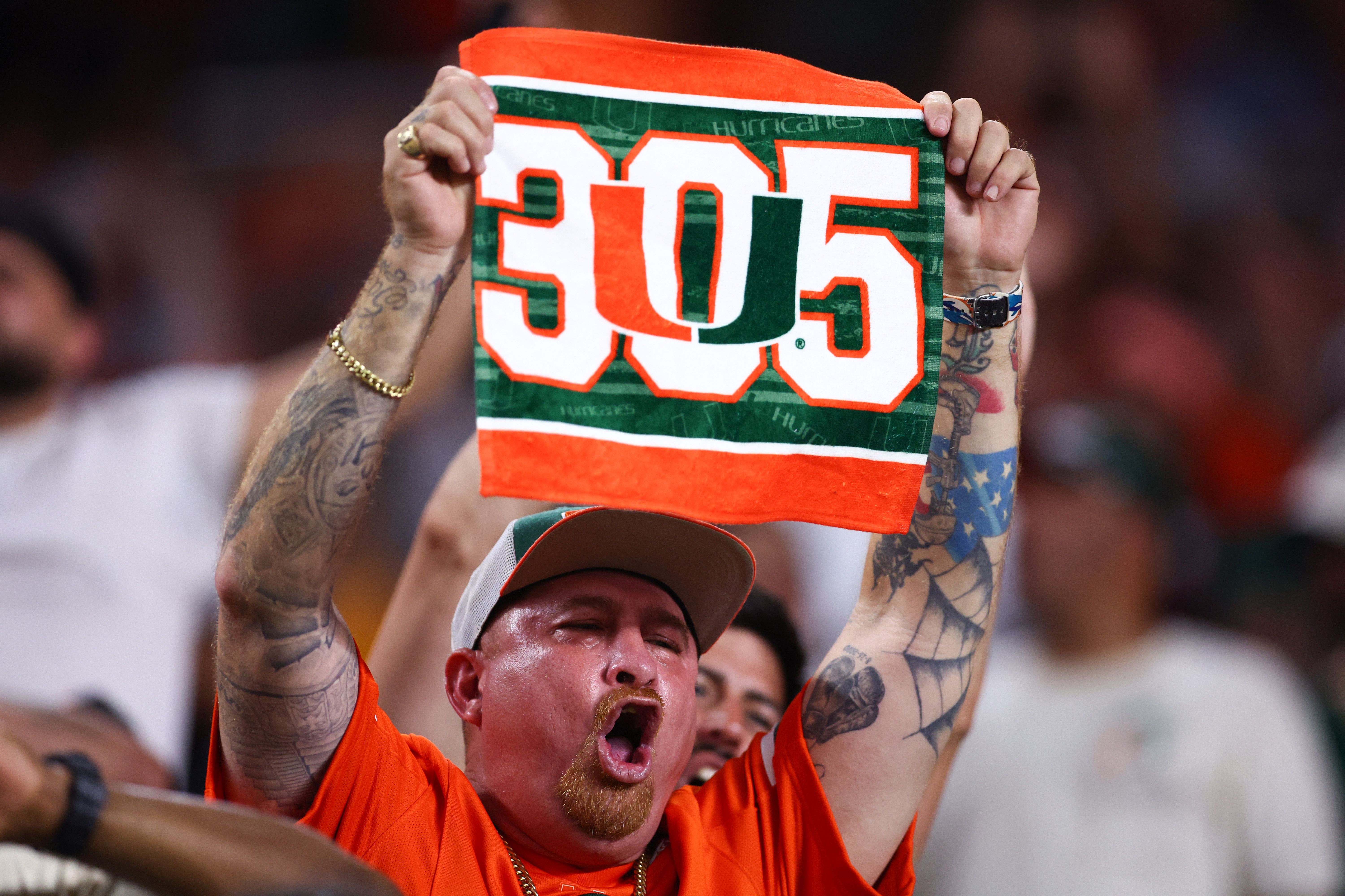 MIAMI GARDENS, FLORIDA - SEPTEMBER 27: A Miami Hurricanes fan cheers during the second half of the game against the Virginia Tech Hokies at Hard Rock Stadium on September 27, 2024 in Miami Gardens, Florida. (Photo by Megan Briggs/Getty Images)
