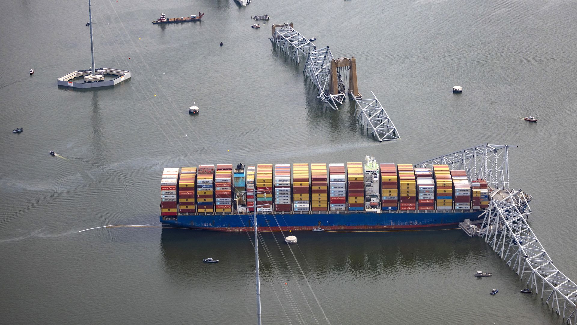 the cargo ship Dali sits in the water after running into and collapsing the Francis Scott Key Bridge 