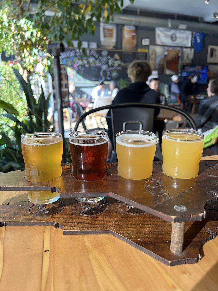 Stop for a flight of beer at Thirsty Souls. Photo: Emma Way/Axios