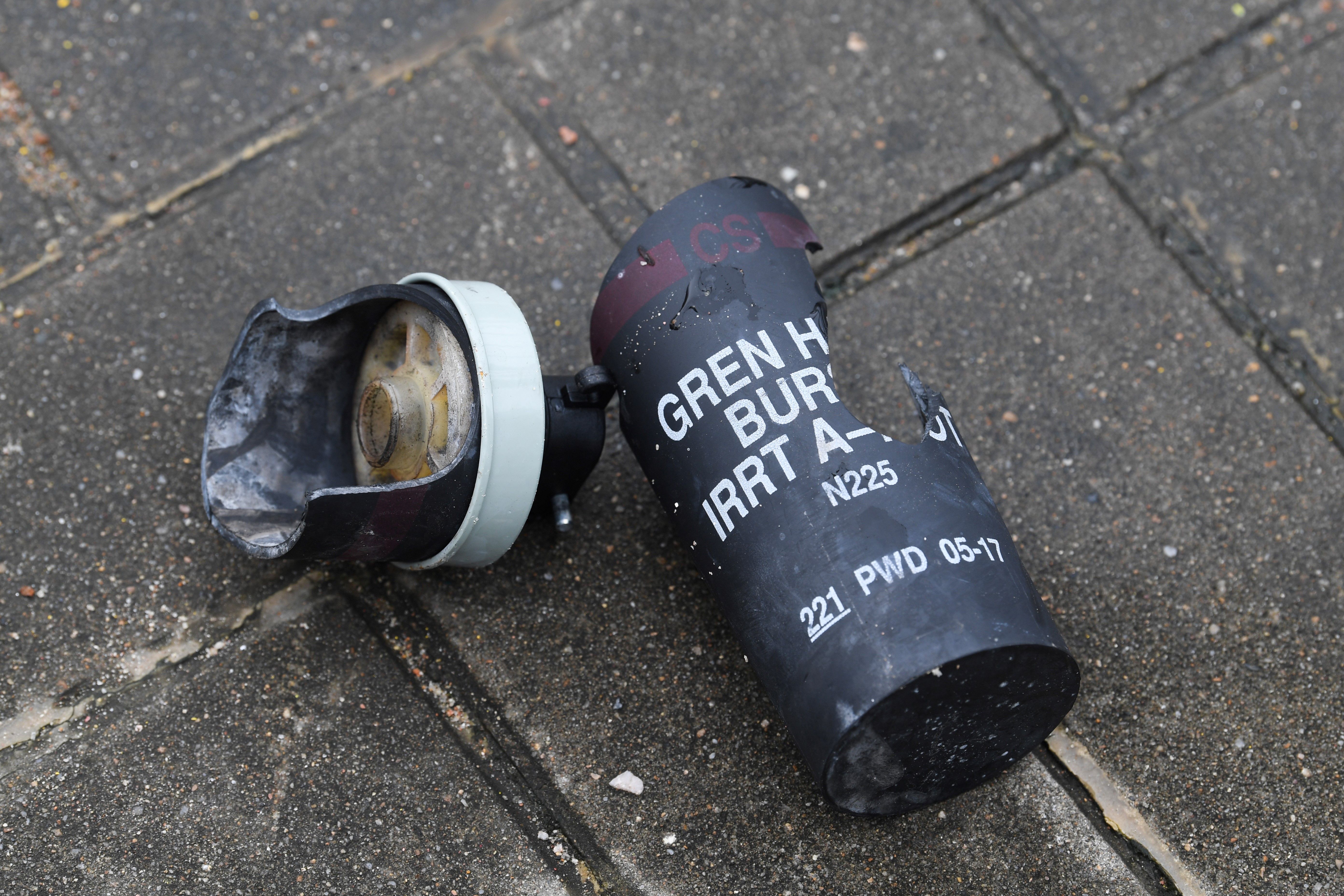  used tear gas shell is seen on a pavement a day after a violent demonstration.