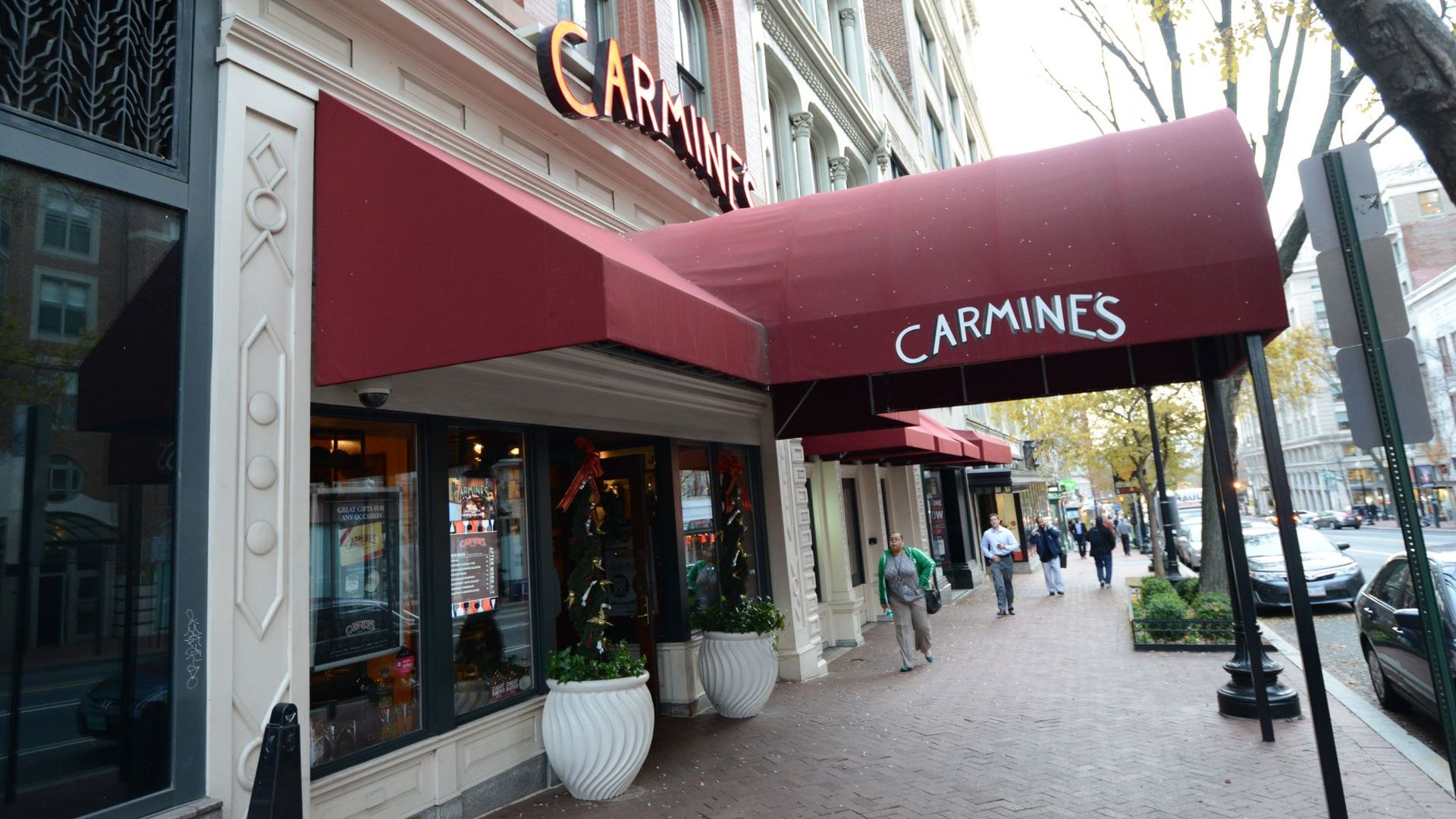 The sidewalk in front of Carmine's in Penn Quarter with a Carmine's red awning