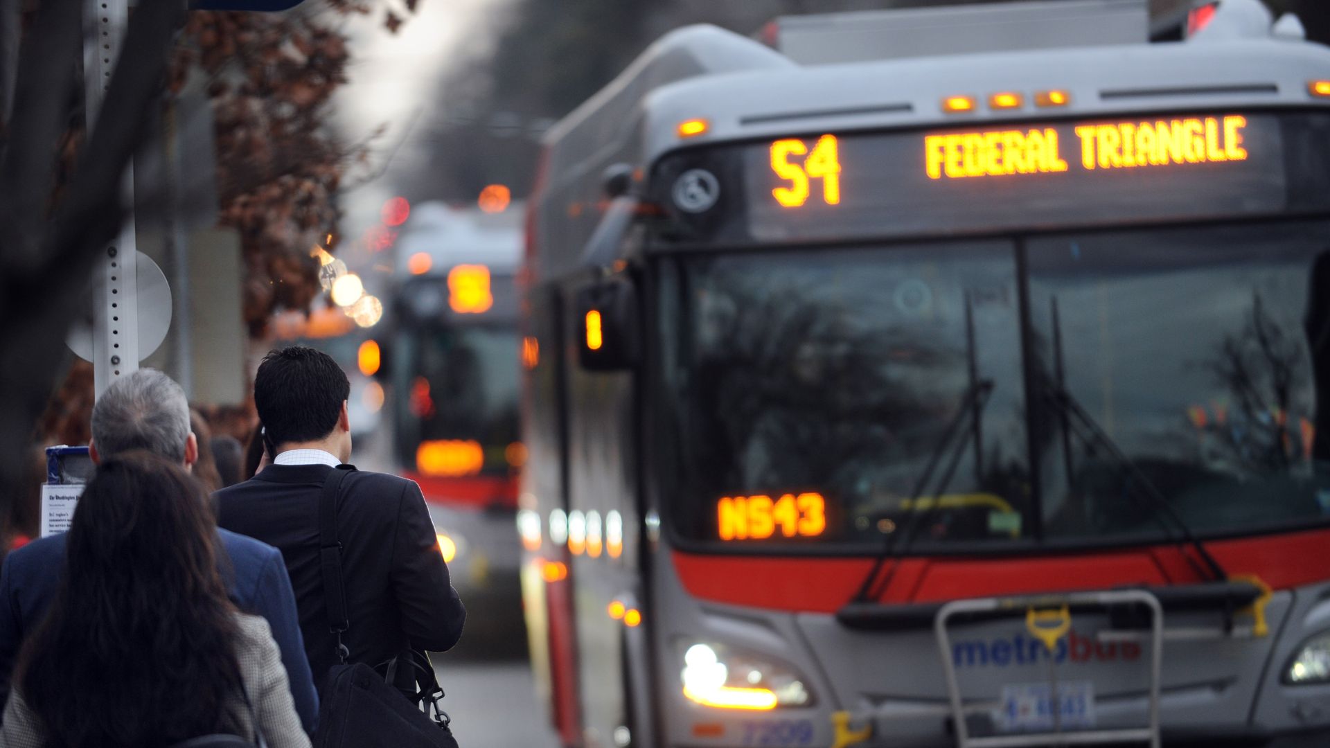 People wait for Metro bus