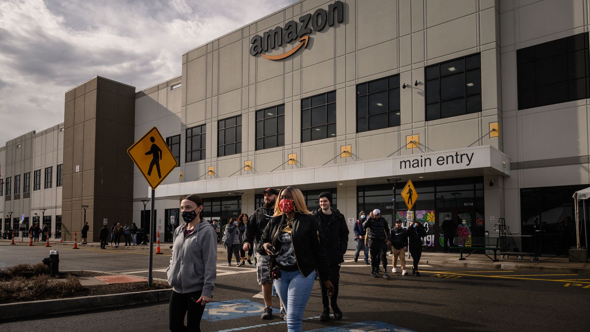 People outside an Amazon warehouse in Staten Island on March 25.