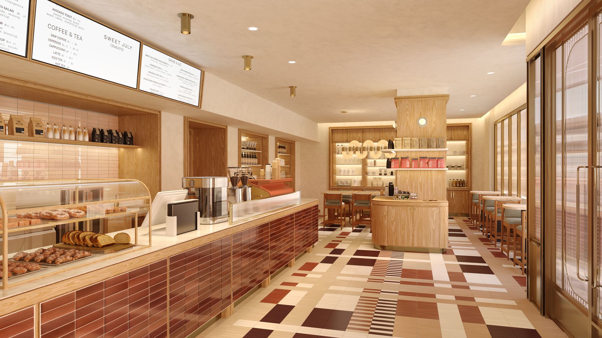Warm bakery cafe with a glass pastry case, espresso machines, wooden shelves, and menu boards. Checkered tile floor, seating along the right by tall glass windows.
