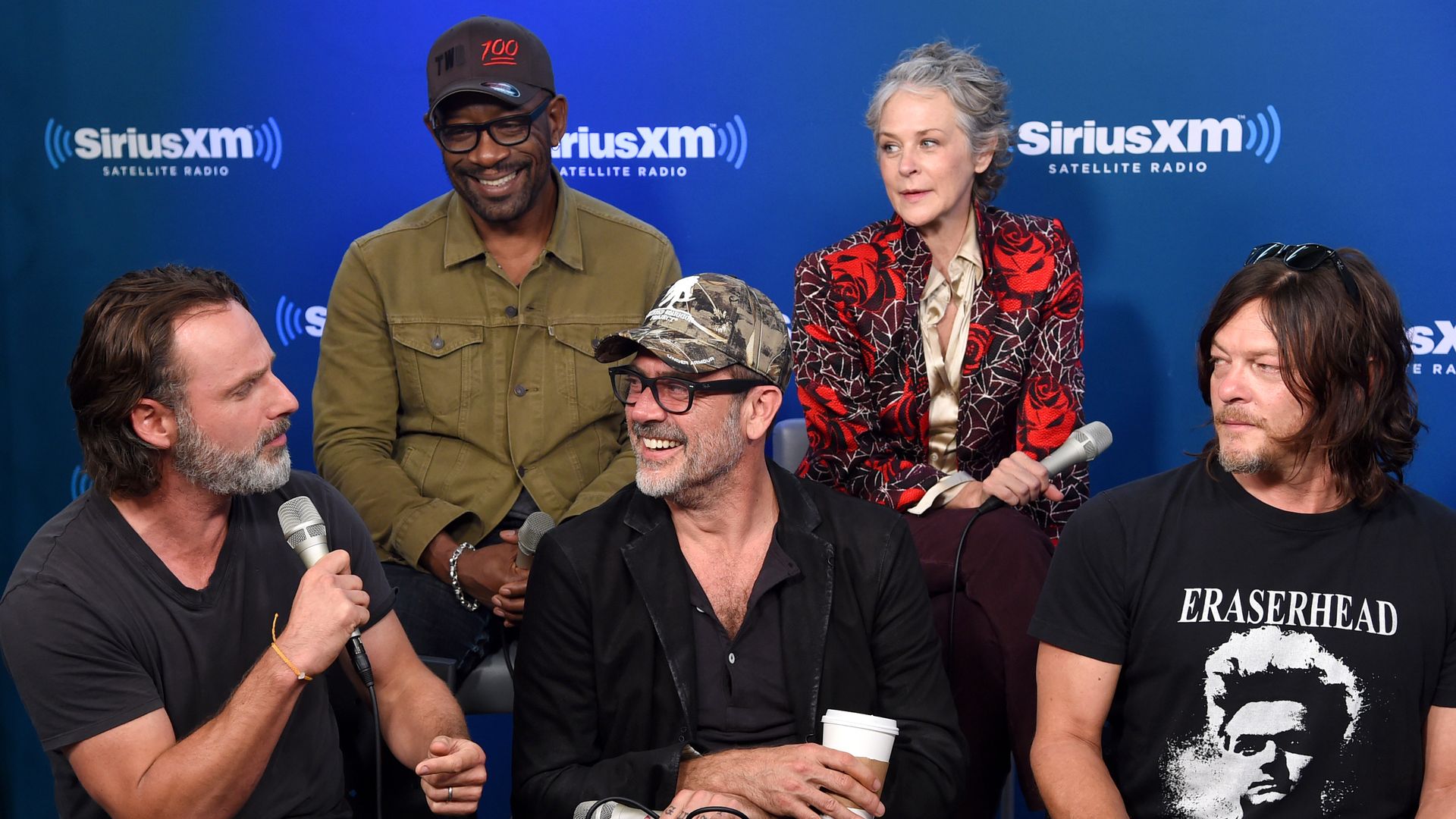 Five cast members from the original "The Walking Dead" series sit for a promo interview in front of a blue "SiriusXM" banner.