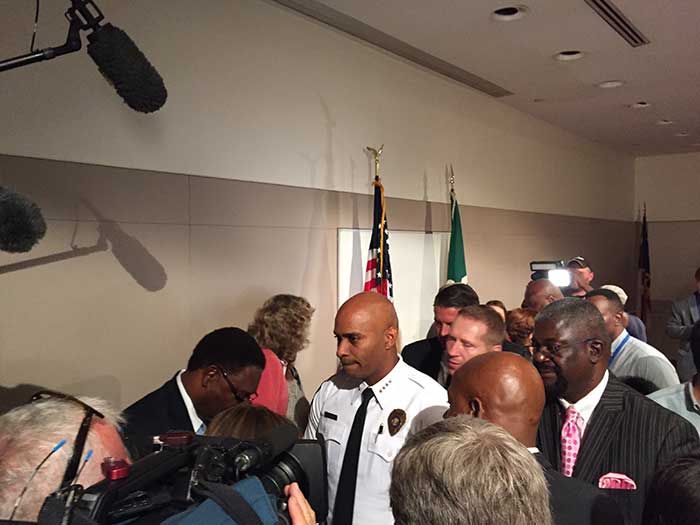 CMPD Chief Kerr Putney, center