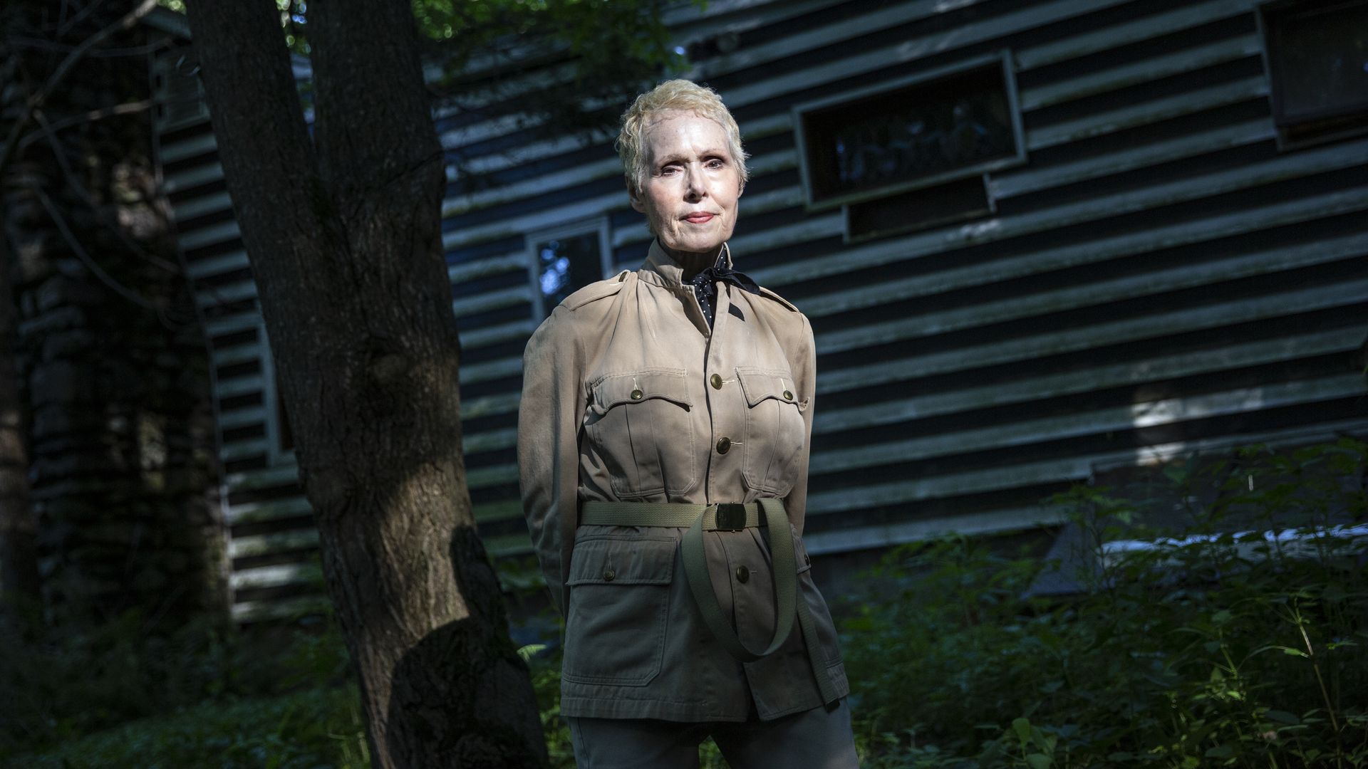 E Jean Caroll in a khaki jacket standing outside 