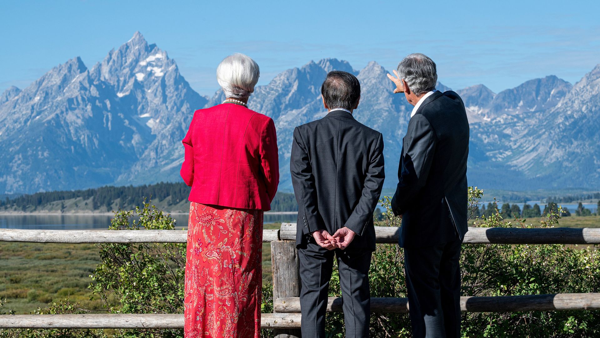 ECB President Christine Lagarde, Bank of Japan Governor Kazuo Ueda, and Fed Chair Jerome Powell gaze at a mountain