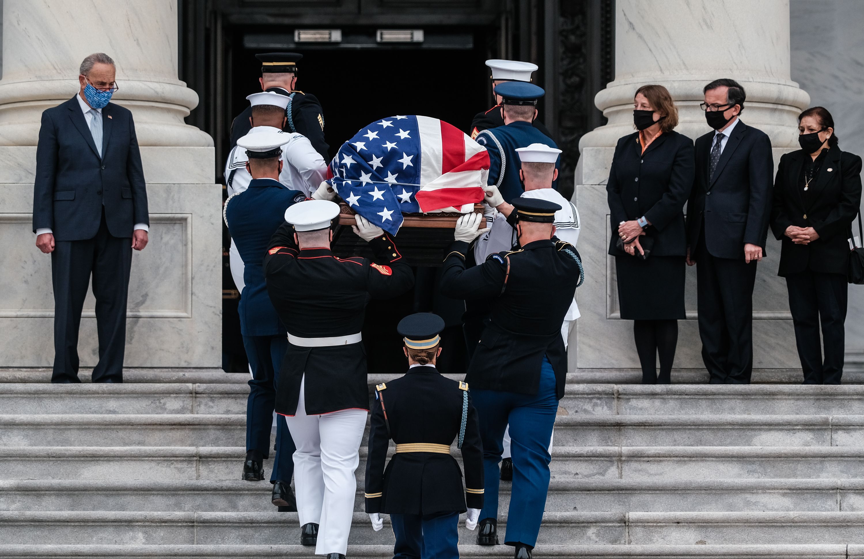 Ginsburg is escorted up the Capitol steps by a military honor guard. Photo: Michael A. McCoy/Getty Images