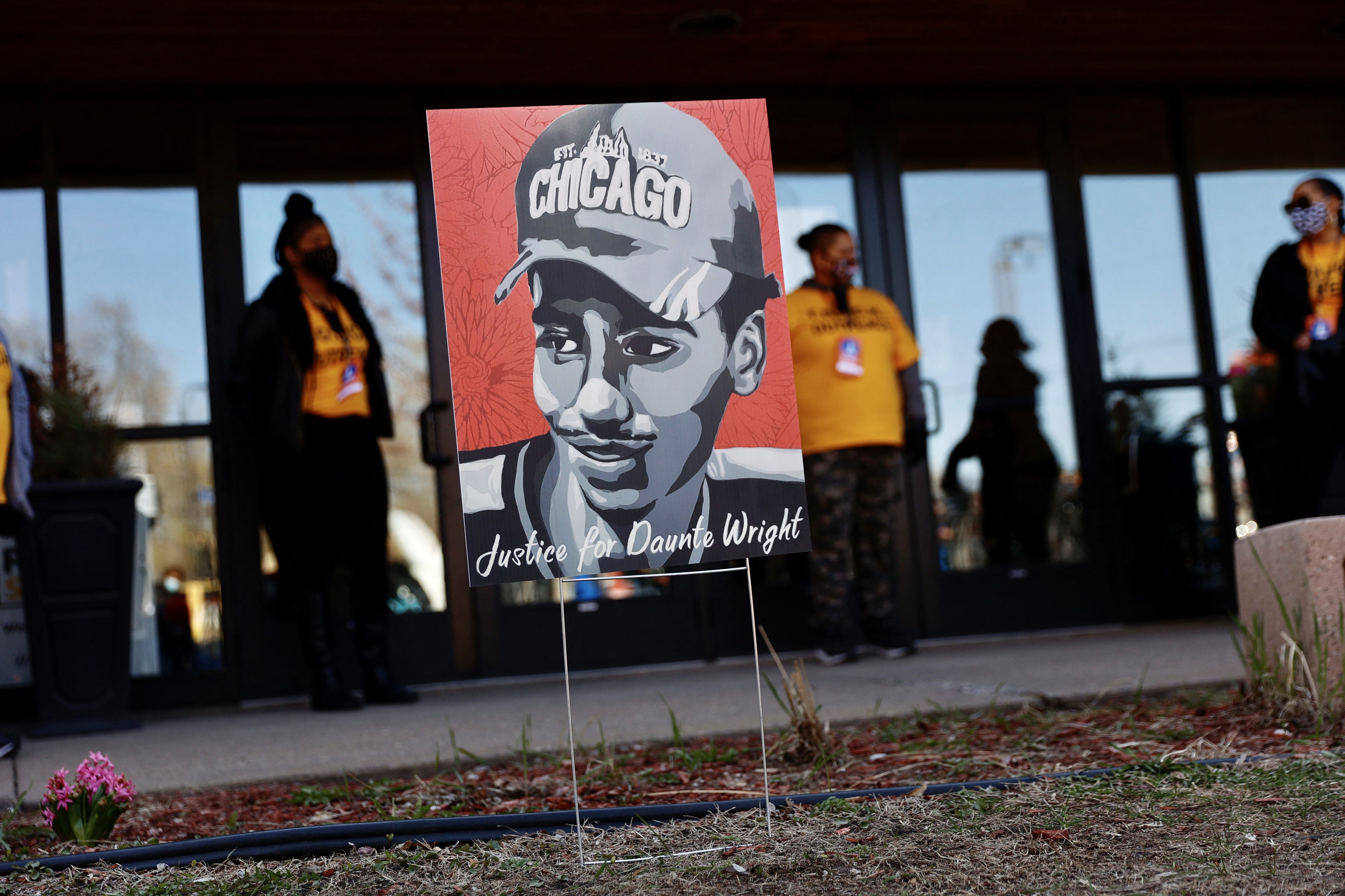 Photo of a painting of Daunte Wright's profile at the site of his funeral