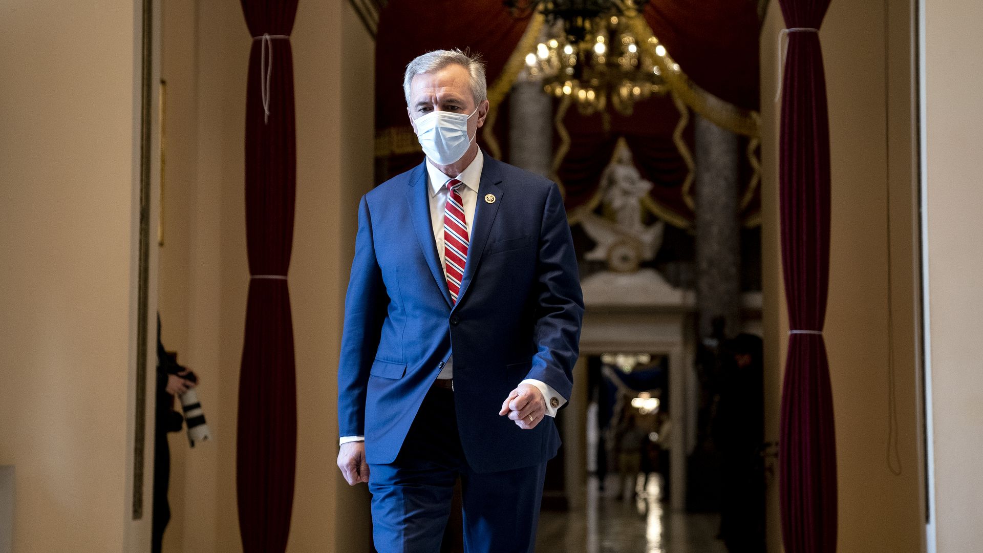 Rep. John Katko (R-NY) wears a protective mask while walking to the House Floor at the U.S. Capitol