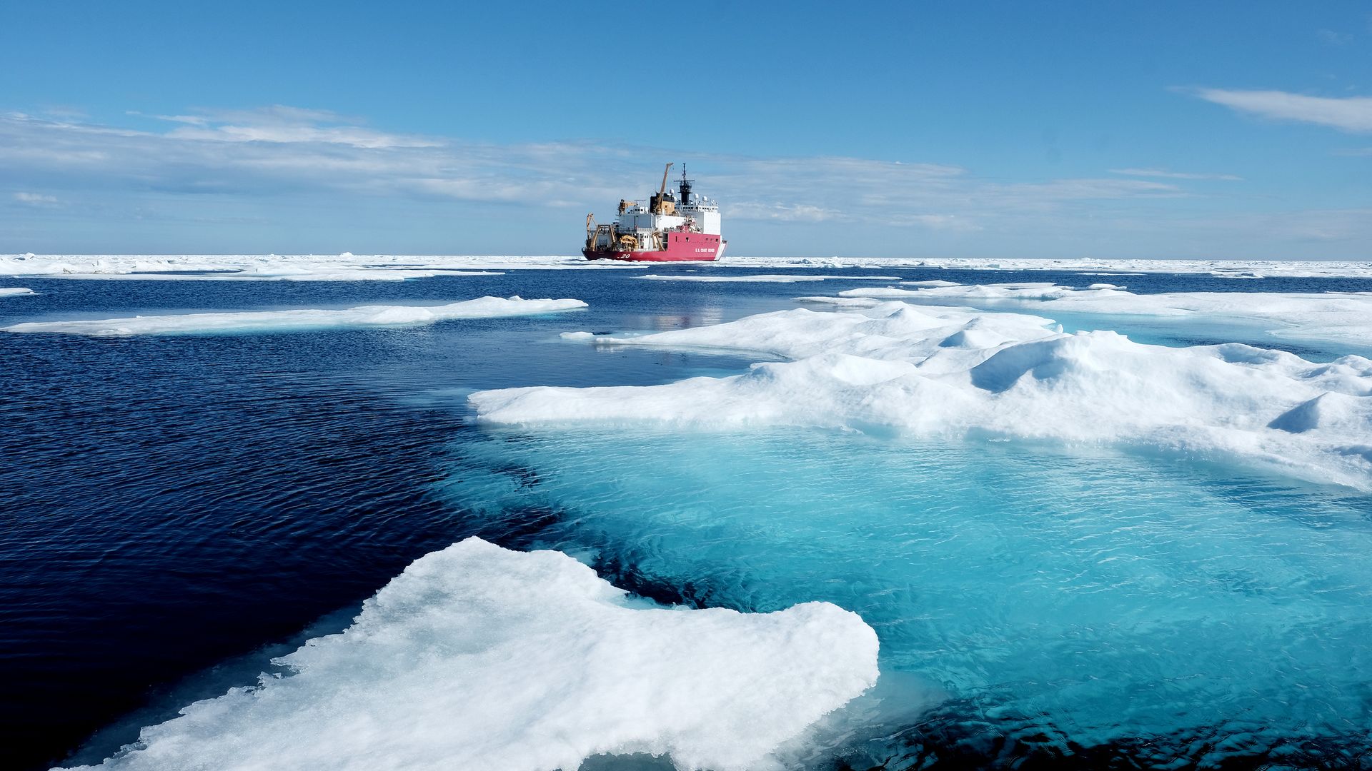 U.S. Coast Guard icebreaker moves through Arctic sea ice.