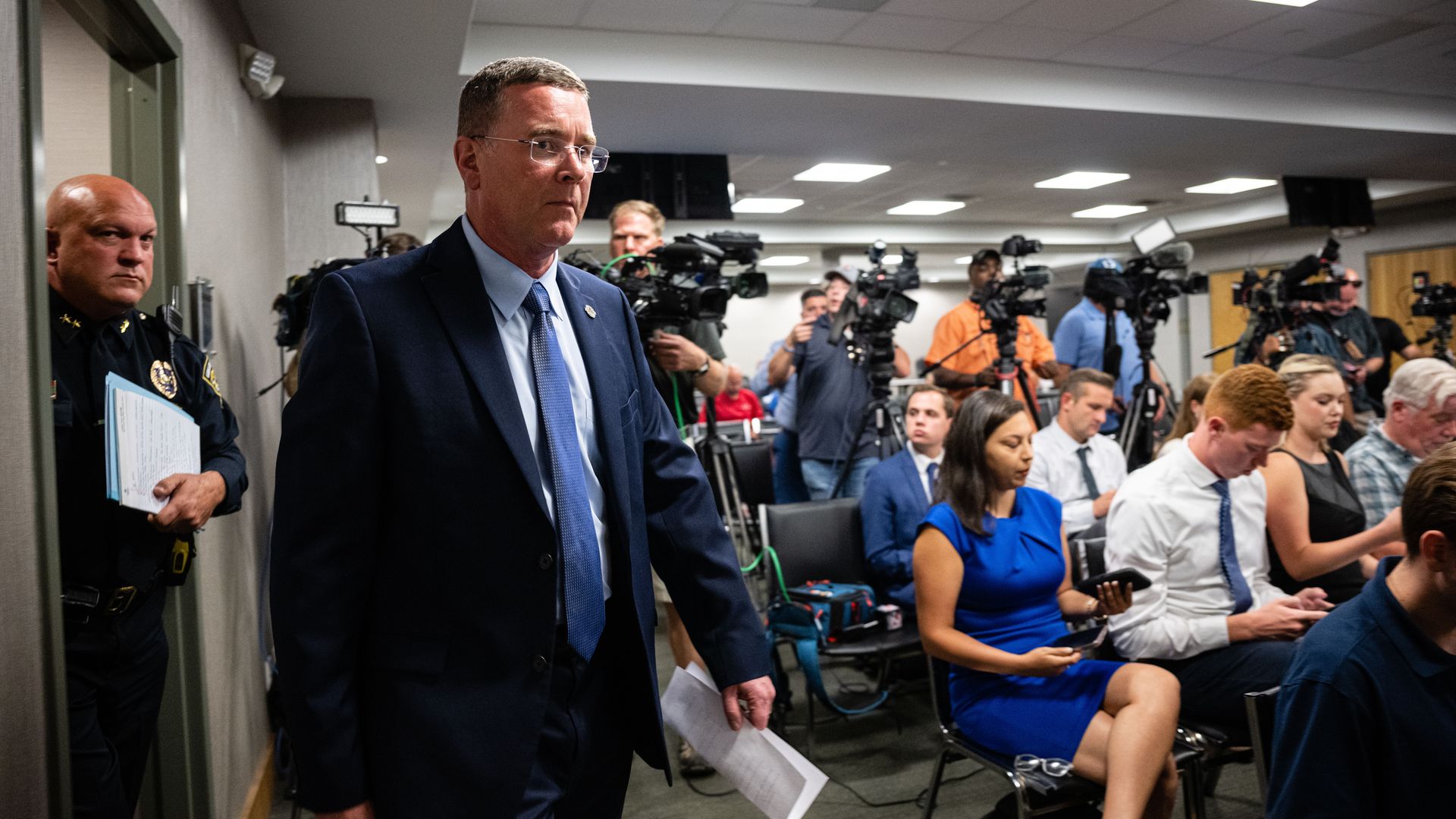 Greenwood Mayor Mark Myers and Greenwood Police Chief Jim Ison entering a press conference on July 18.