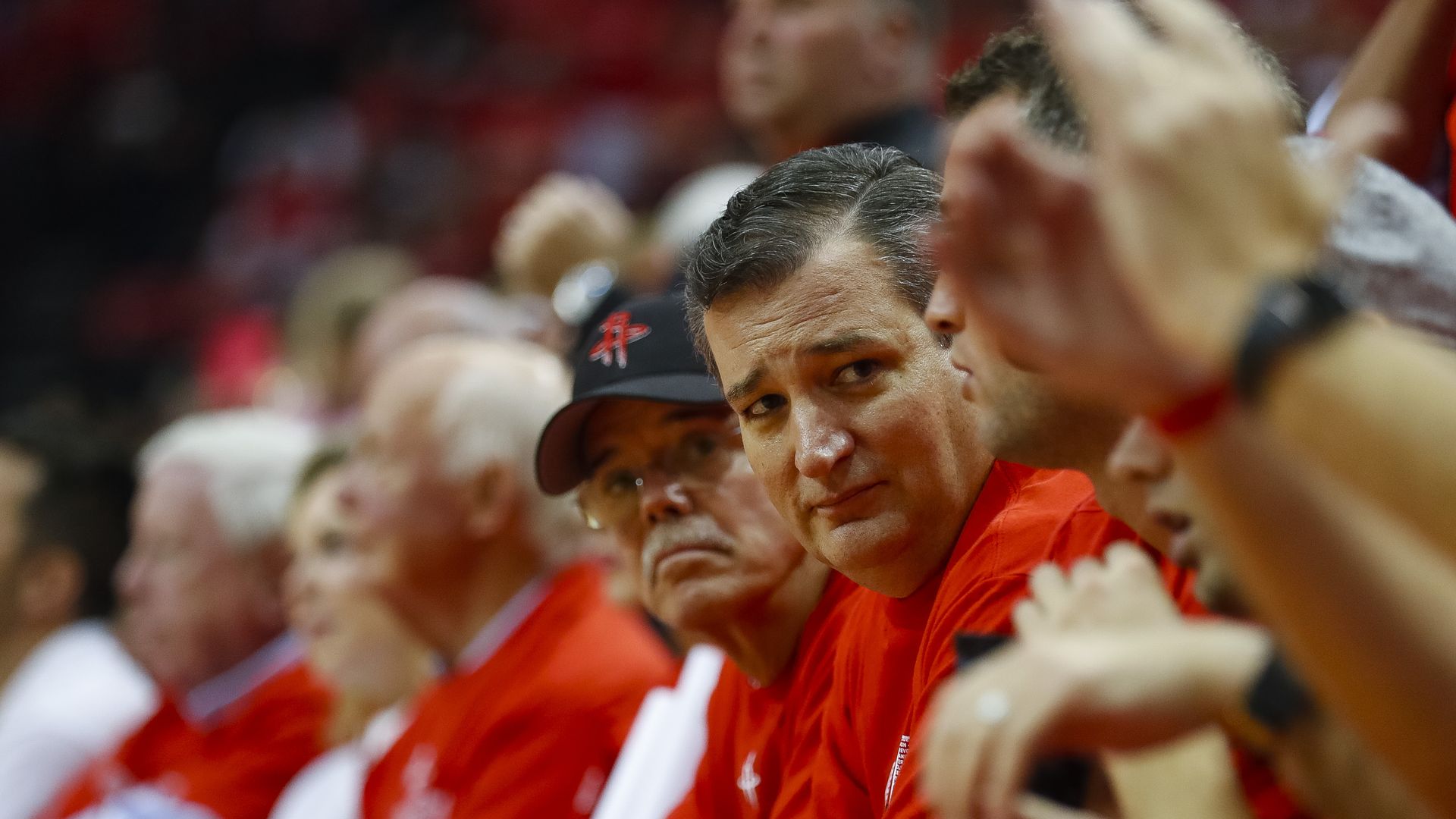 Ted Cruz looks to the side during a playoff NBA game