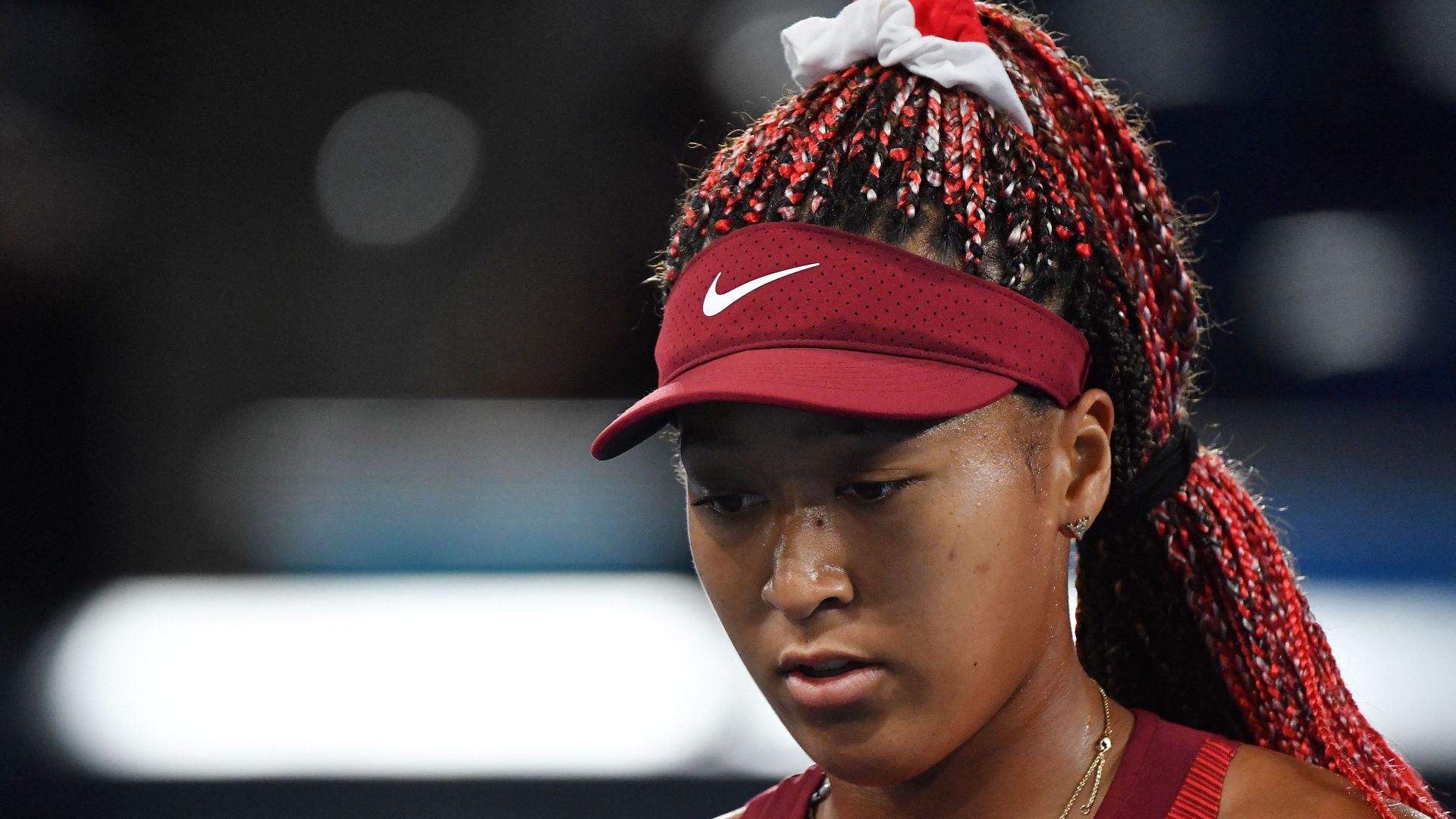  Japan's Naomi Osaka competes against Czech Republic's Marketa Vondrousova during their Tokyo 2020 Olympic Games women's singles third round tennis match at the Ariake Tennis Park in Tokyo on July 27