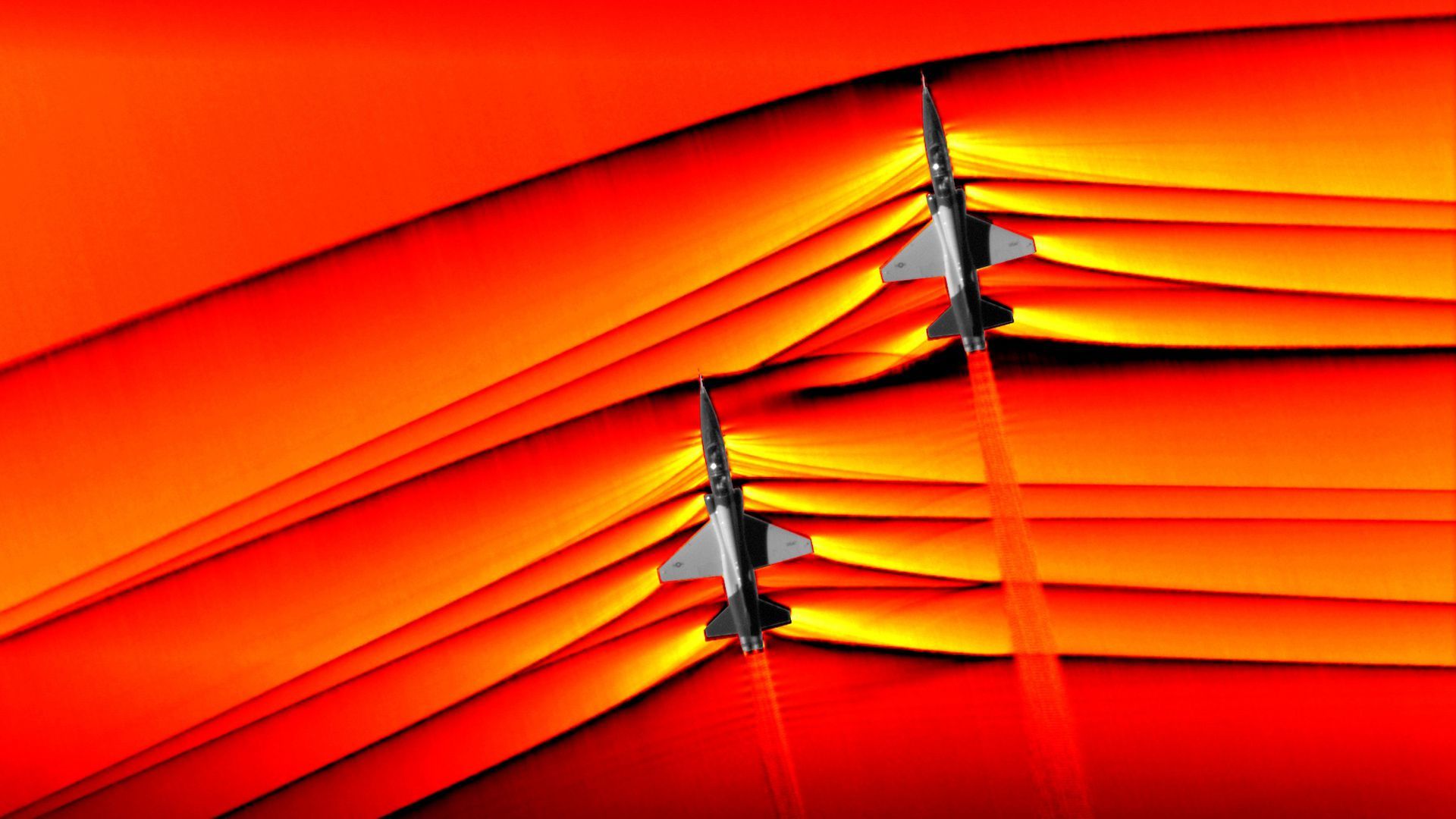 Airplanes breaking the sound barrier.