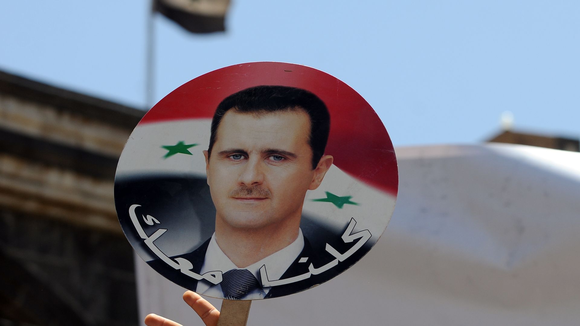 A sign of Syrian President Bashar al-Assad's face.