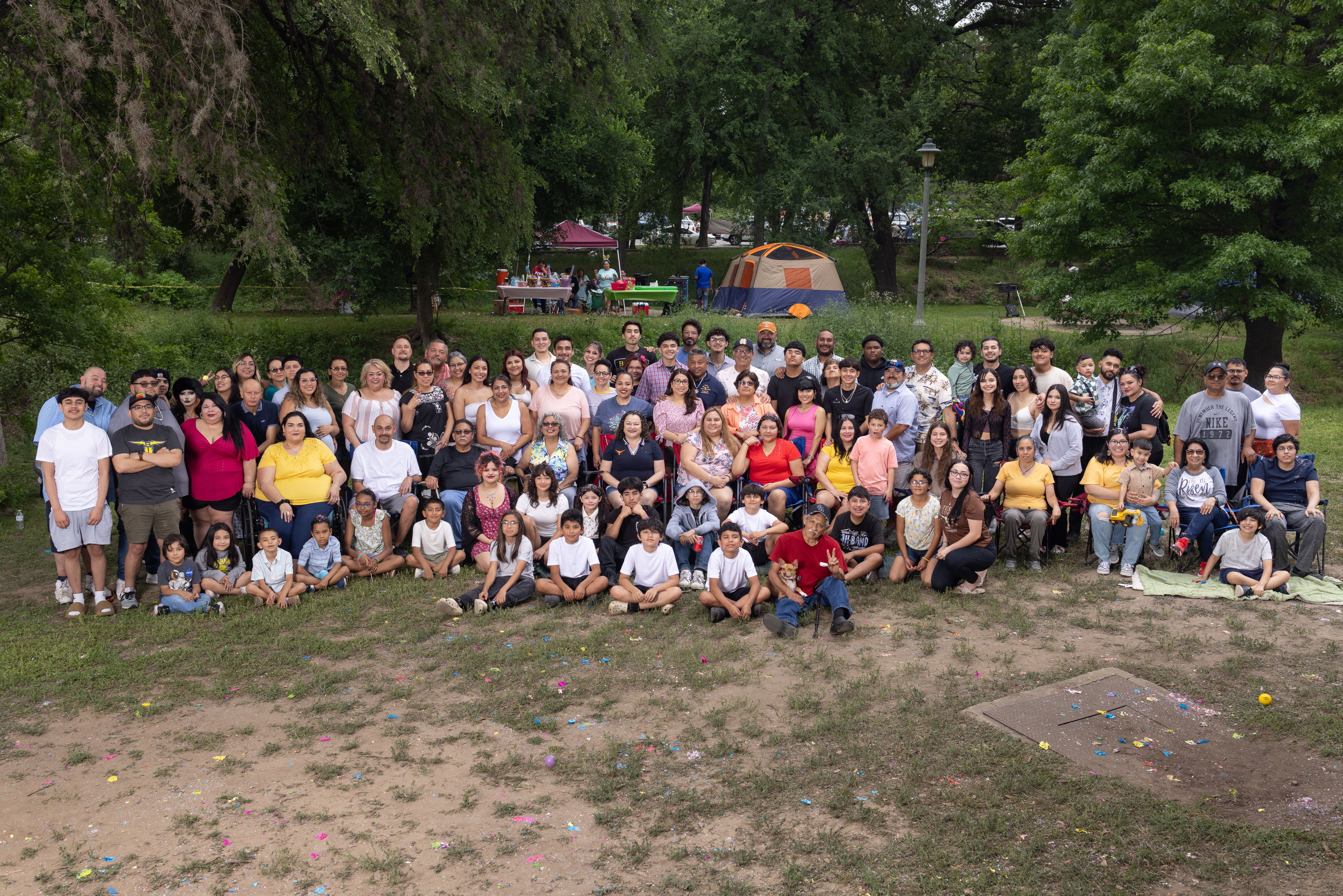 The whole Cerna family on Easter in front of tents at the park.