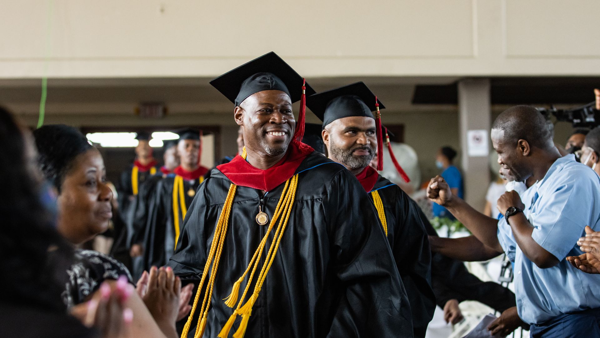 Graduates proceeding at graduation 