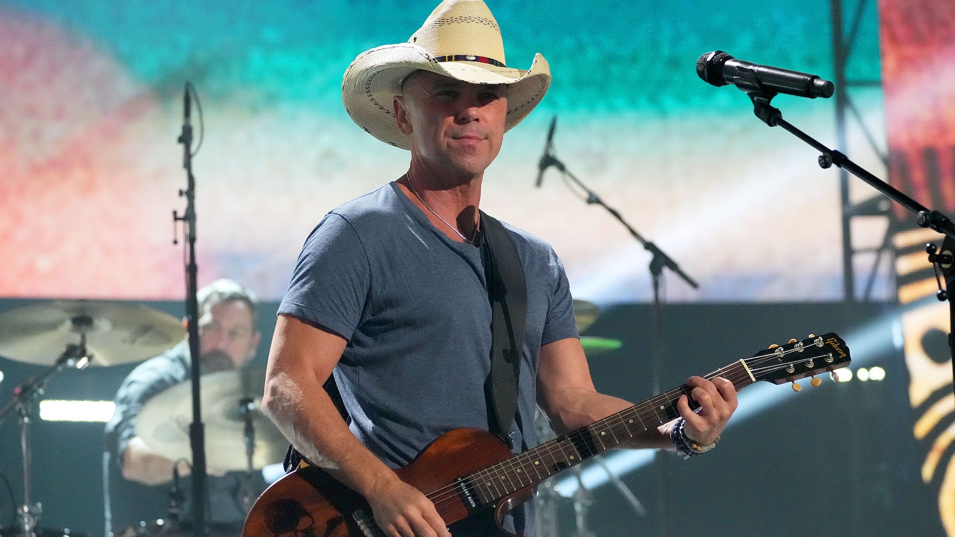 Country singer Kenny Chesney performs on stage. 