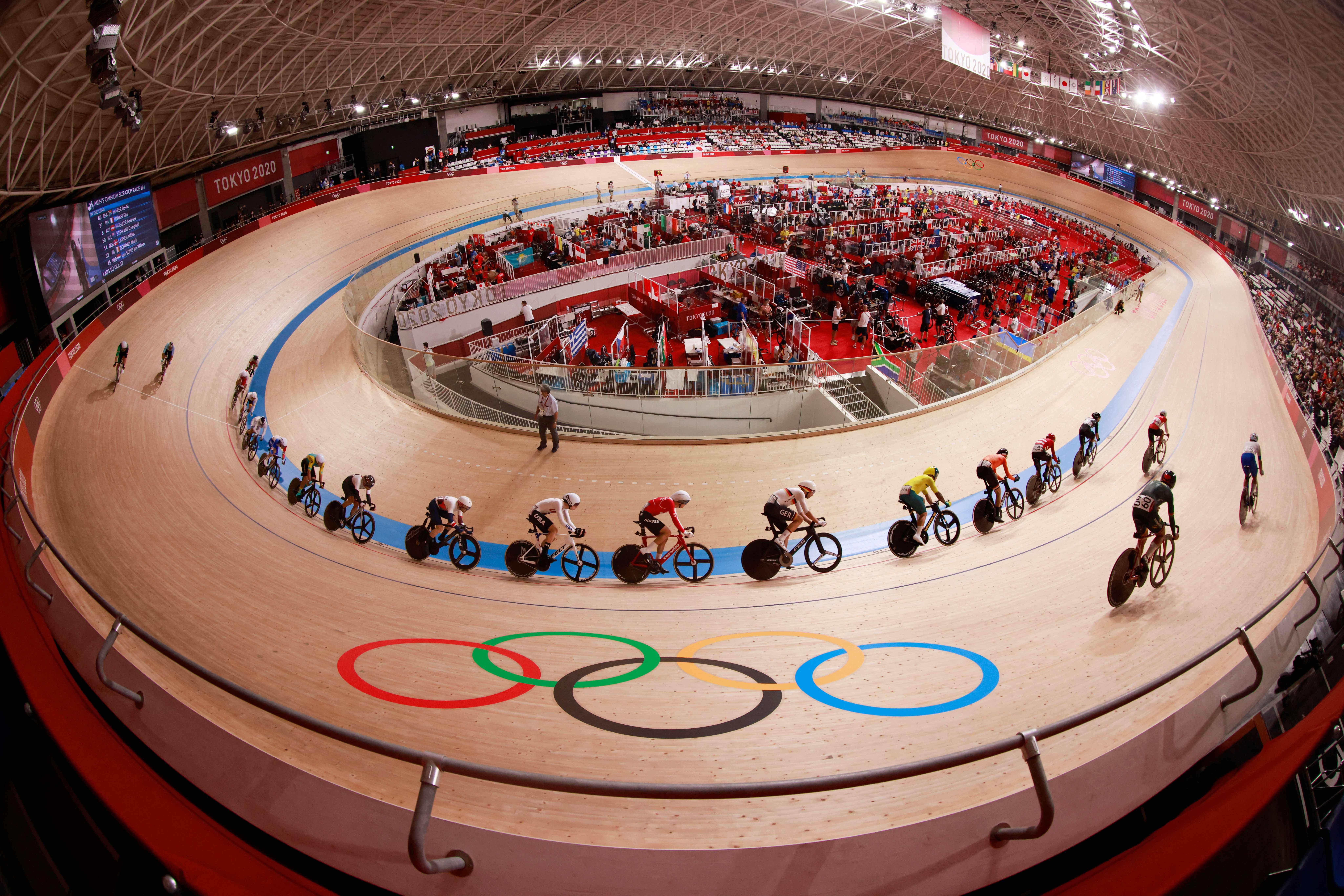 Cyclists compete in the men's track cycling omnium scratch race during the T Olympic Games at Izu Velodrome in Izu, Japan, on August 5