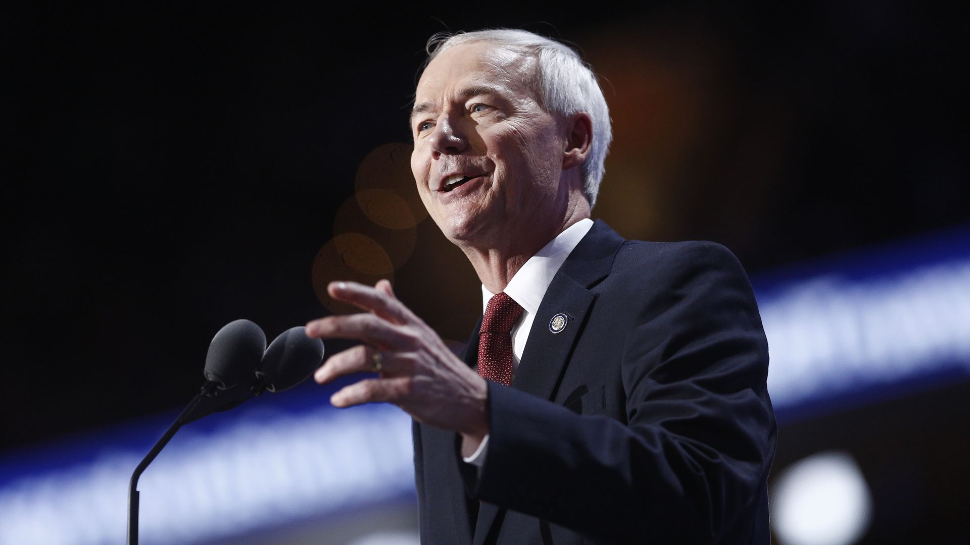 Photo of Asa Hutchinson speaking into a mic