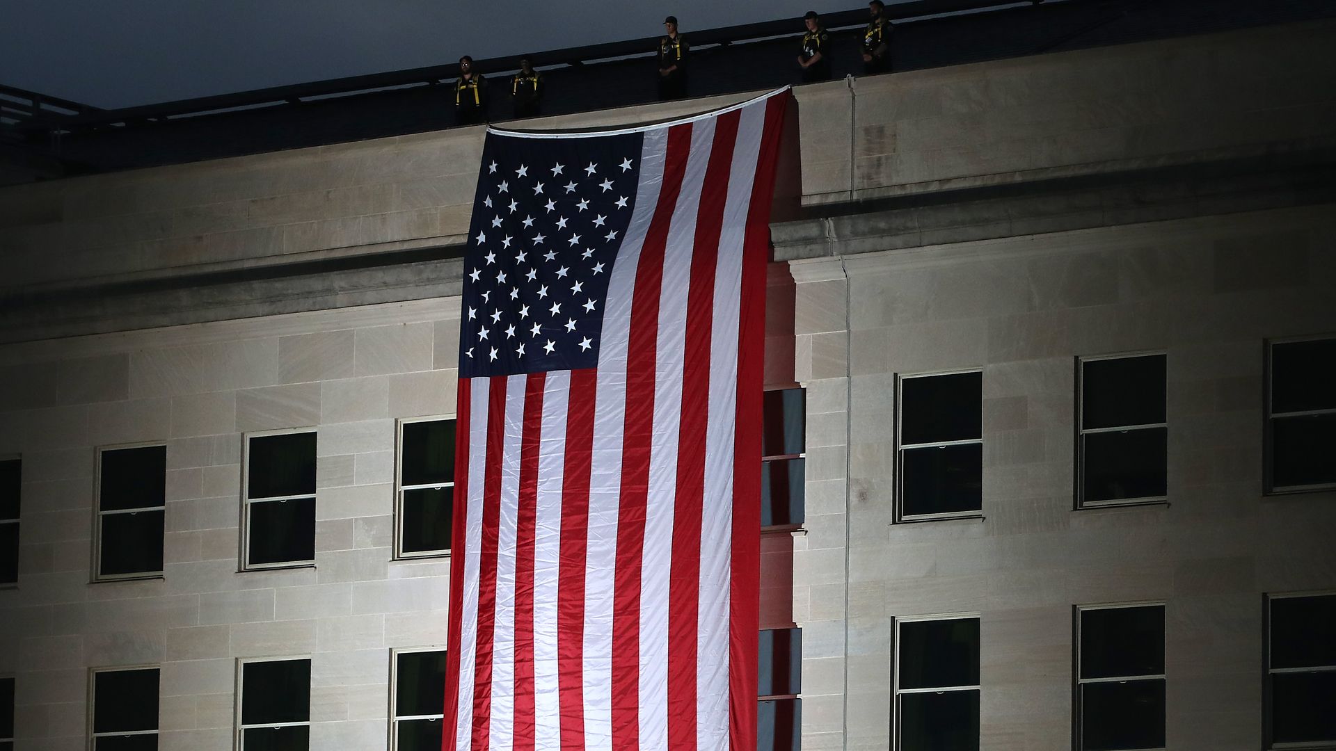  An American flag is unfurled on the side of the Pentagon to commemorate the anniversary of the 9/11 terror attacks September 11, 2019 in Arlington, Virginia