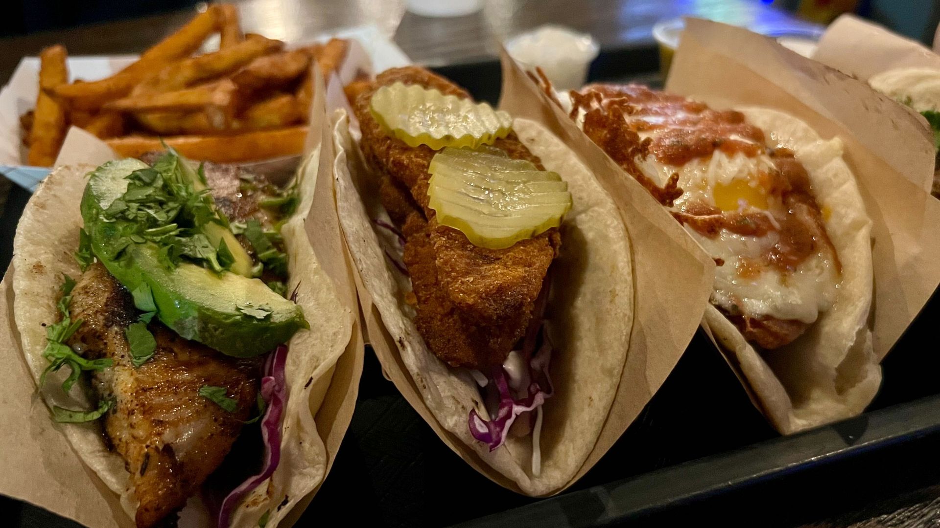 A photo of three tacos