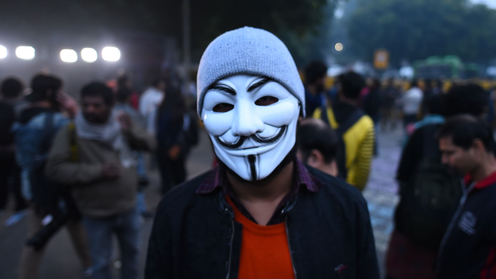 Protester wearing guy fawkes mask
