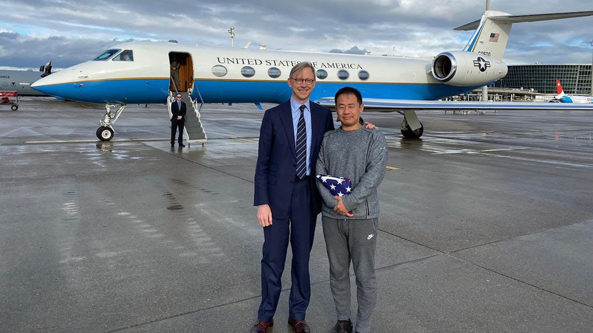 Brian Hook stands with Xiyue Wang in Zurich today. Photo: State Department via AP