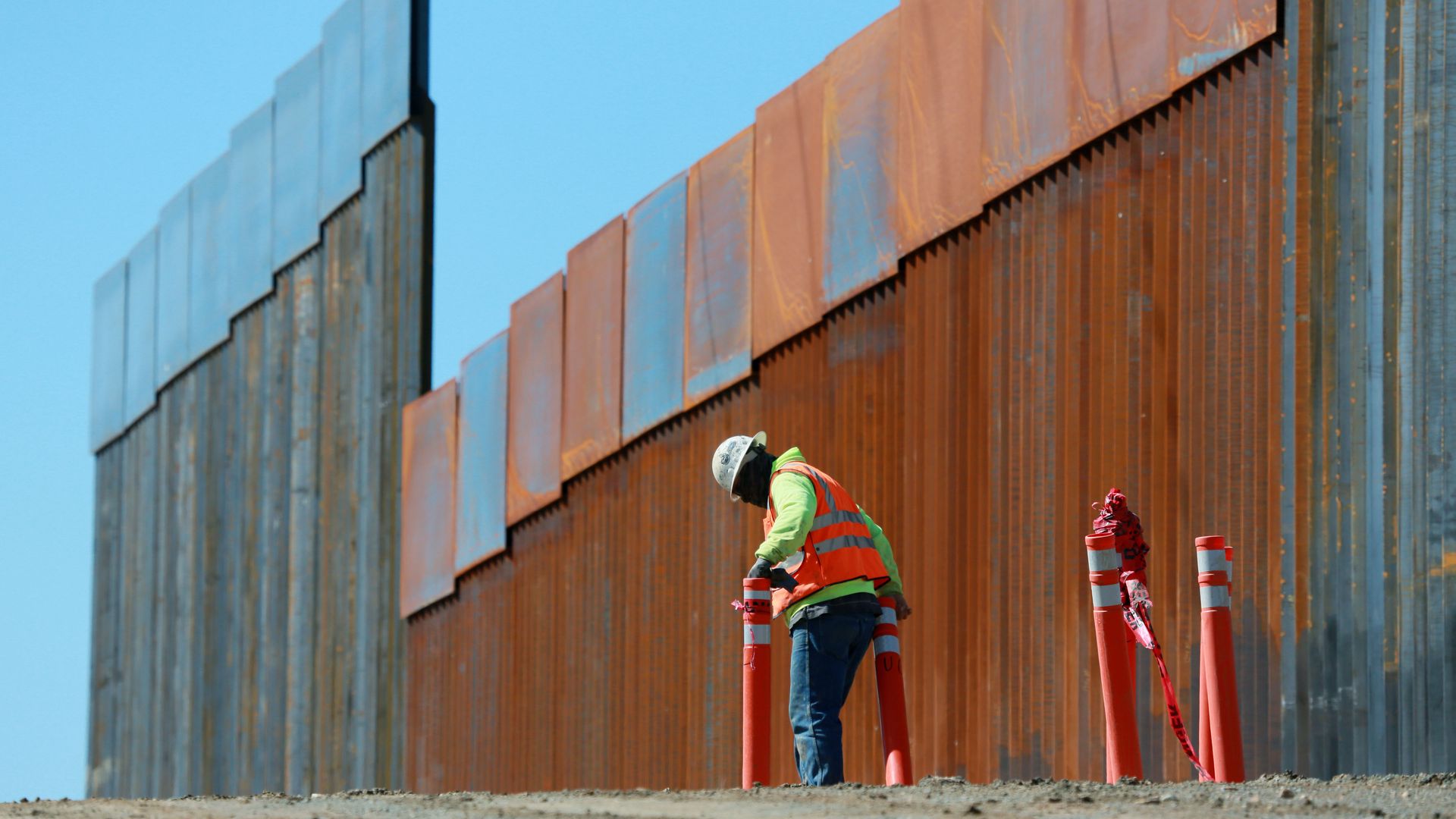 Construction worker build a secondary border wall in February in Otay Mesa, California.
