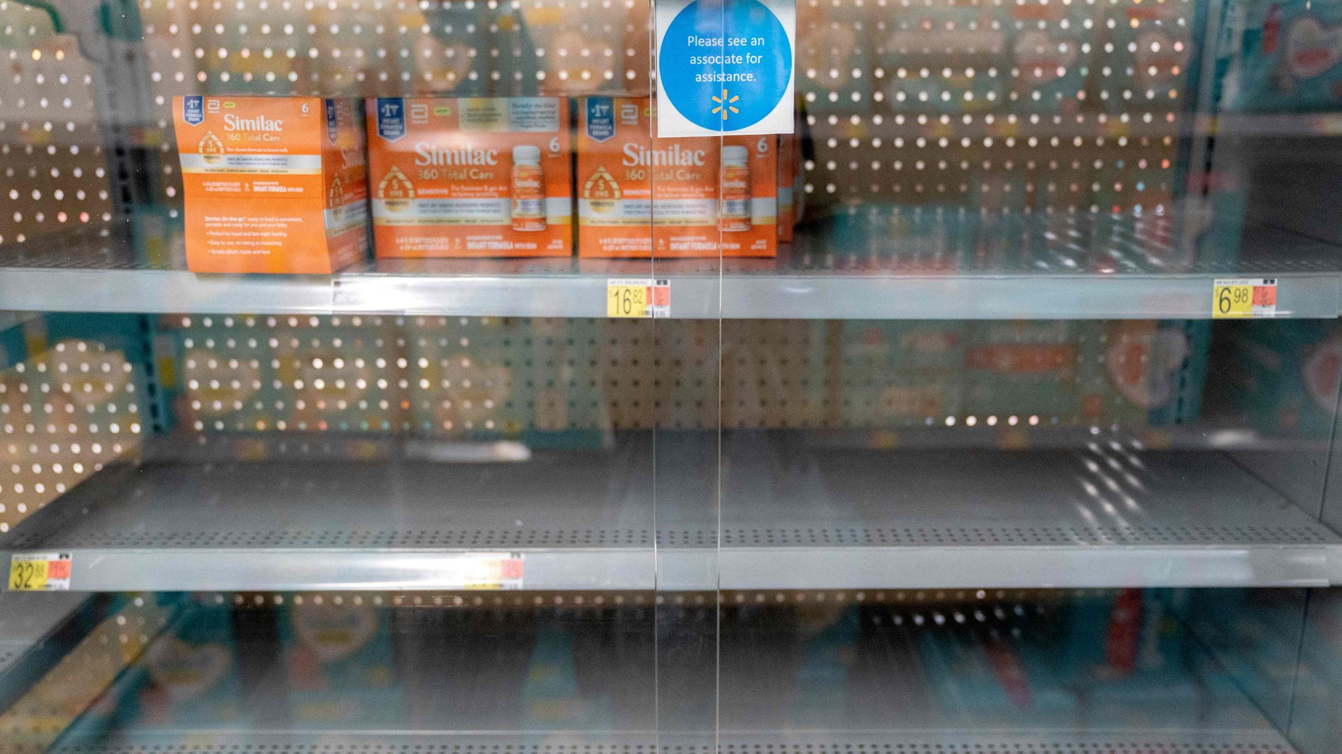 Grocery store shelves where baby formula is stored.