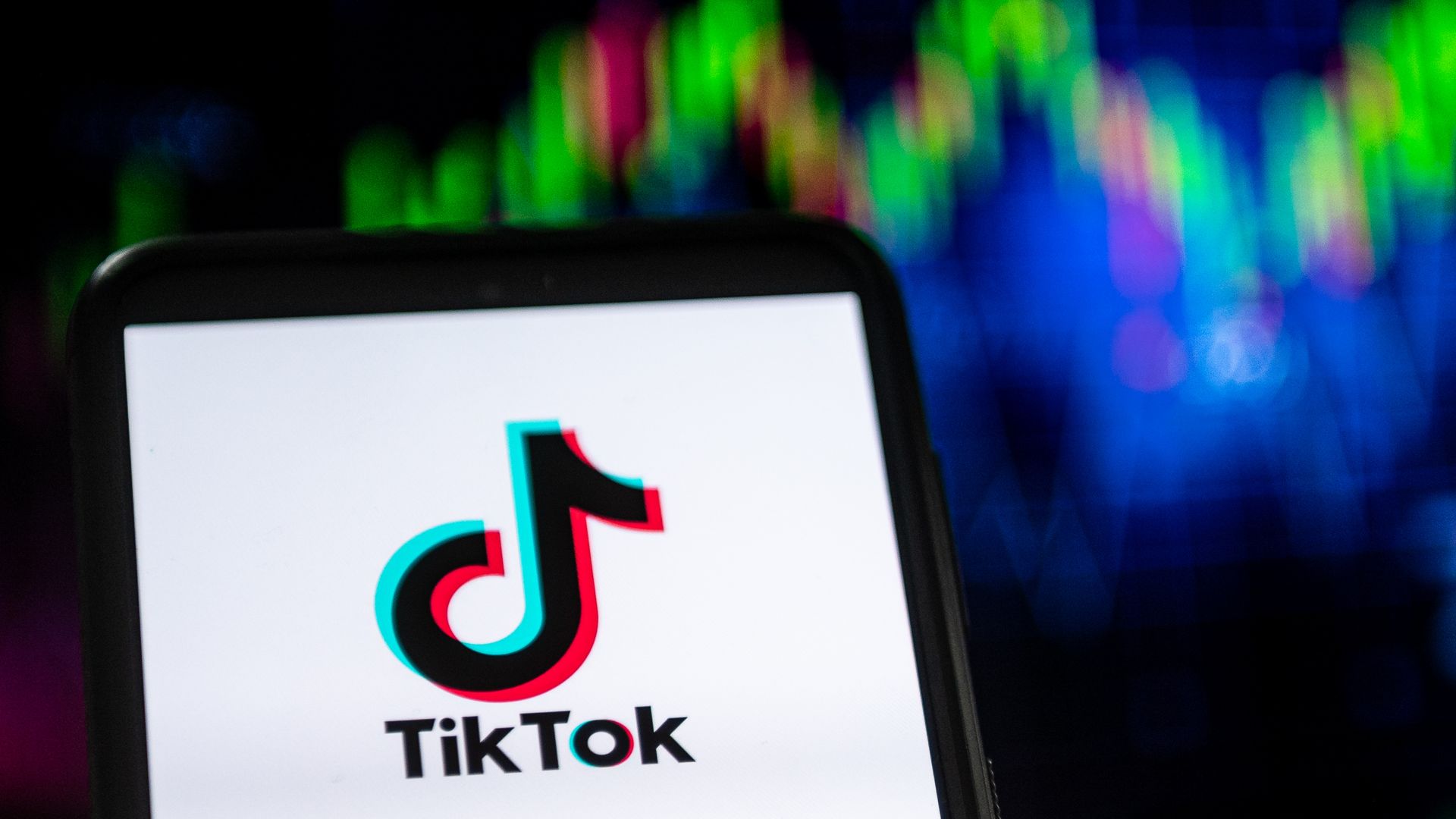 In this photo illustration a TikTok logo seen displayed on a smartphone.