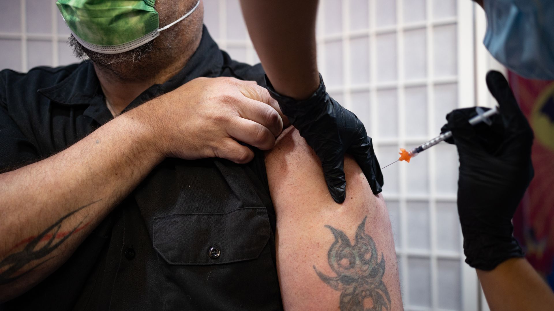 A health care worker administering a Novavax Covid-19 vaccine at a pharmacy in Schwenksville, Pennsylvania, in August 2022.